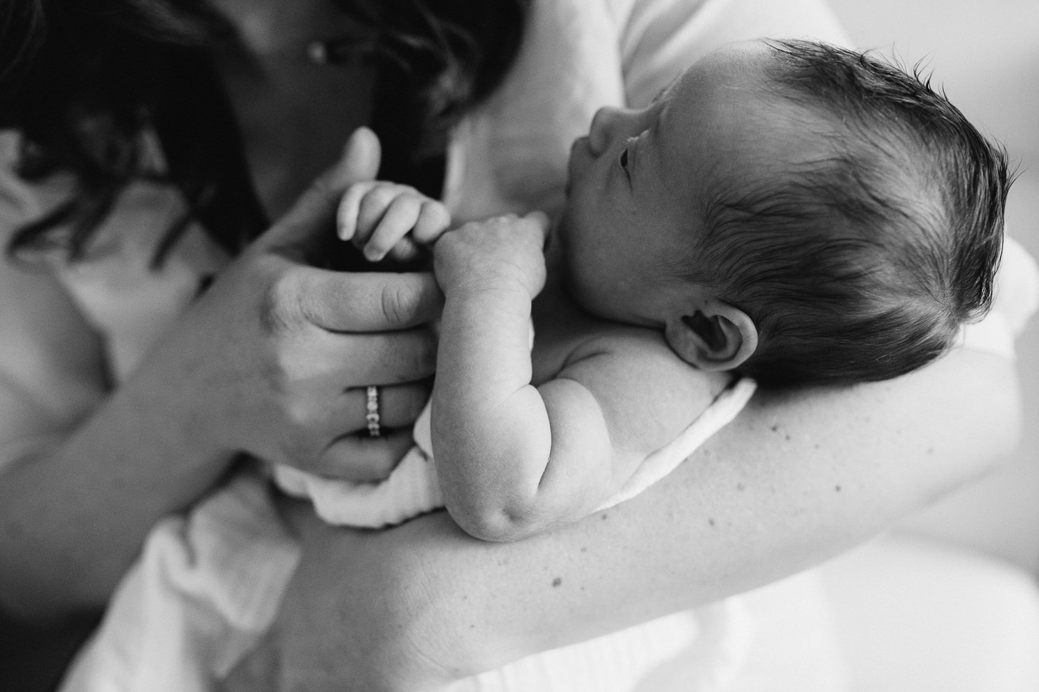 new mom holding 2 week old baby daughter's hand, close up of chubby arms - Stouffville Lifestyle Photography