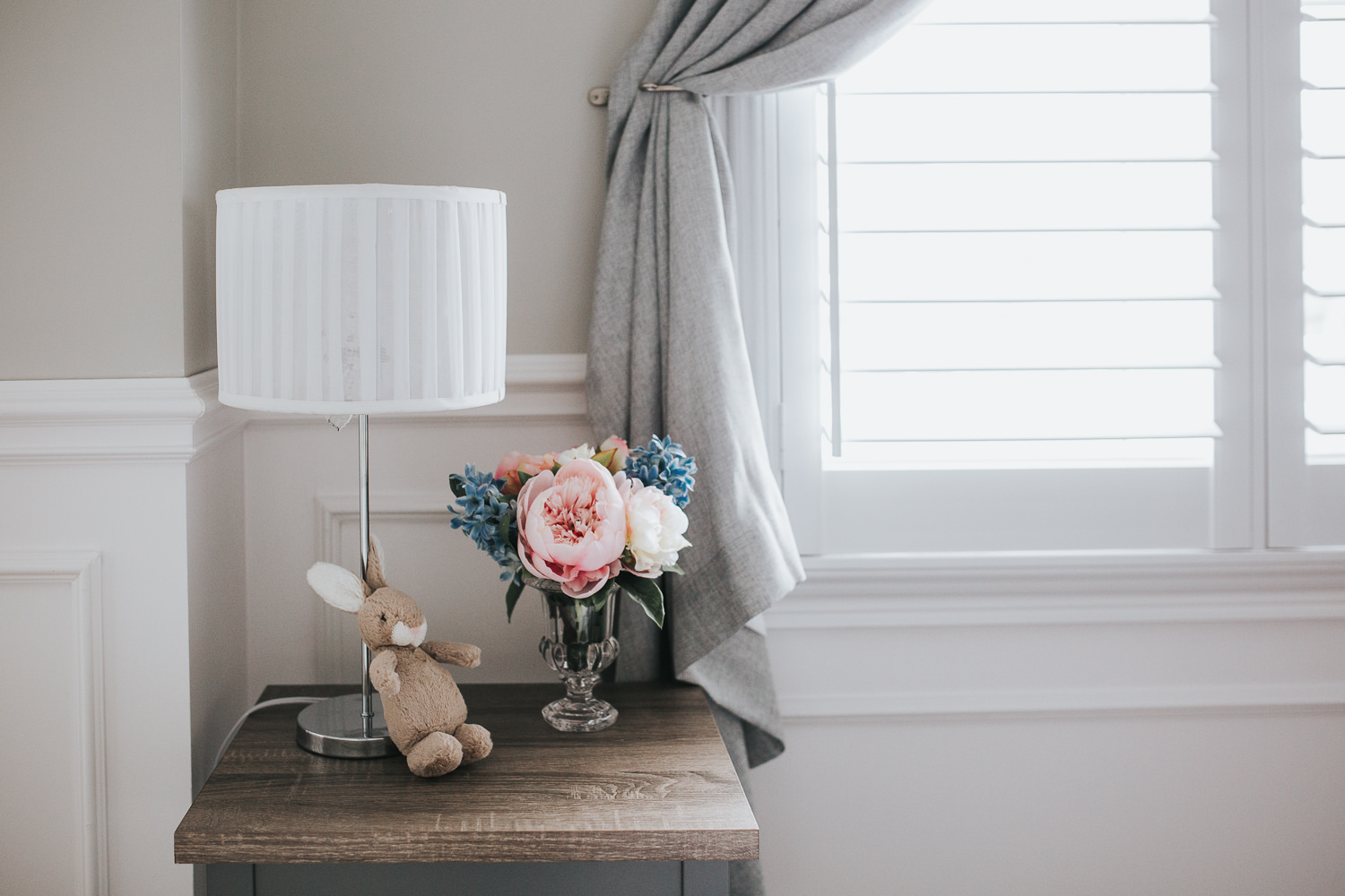 nursery details, side table with pastel peonies and plush bunny - Newmarket Lifestyle Photography 