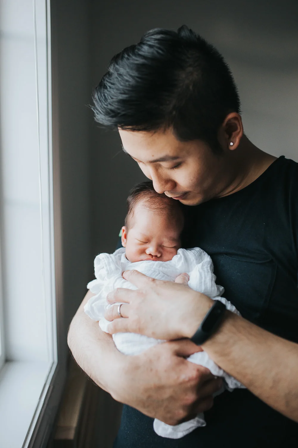 First time dad hold sleeping, swaddled 2 week old baby boy - Newmarket Lifestyle Photos