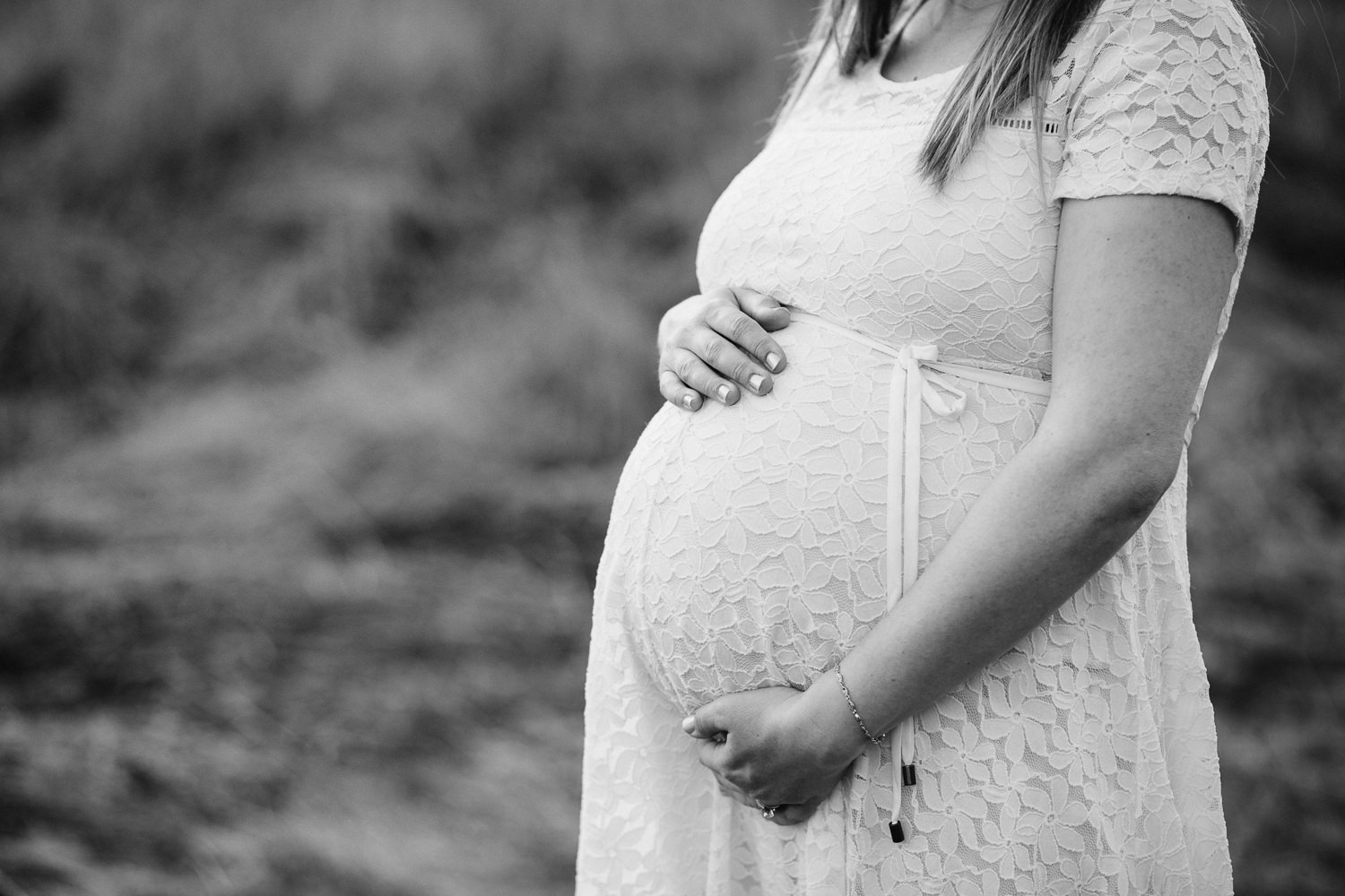 close up of woman holding pregnant baby bump - Uxbridge Lifestyle Photography