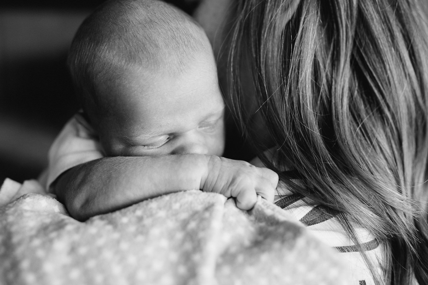 2 week old baby boy snuggled up on mom's shoulder - Uxbridge In-Home Photography