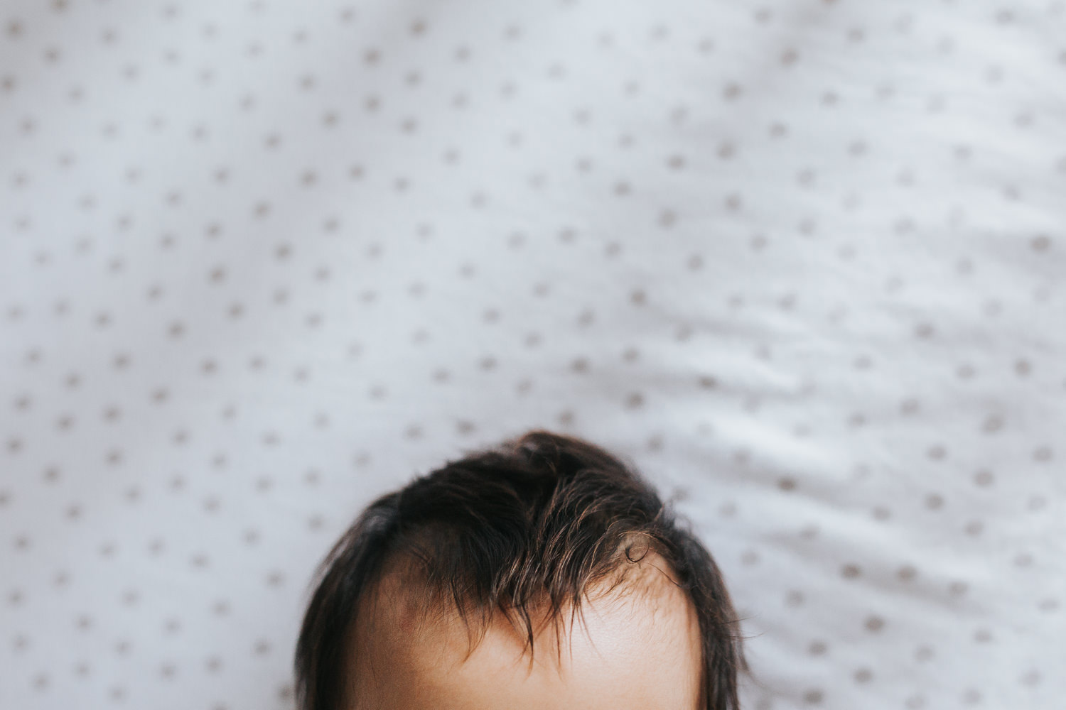 close up of 3 month old baby girl's long, dark brown hair - Stouffville Lifestyle Photography