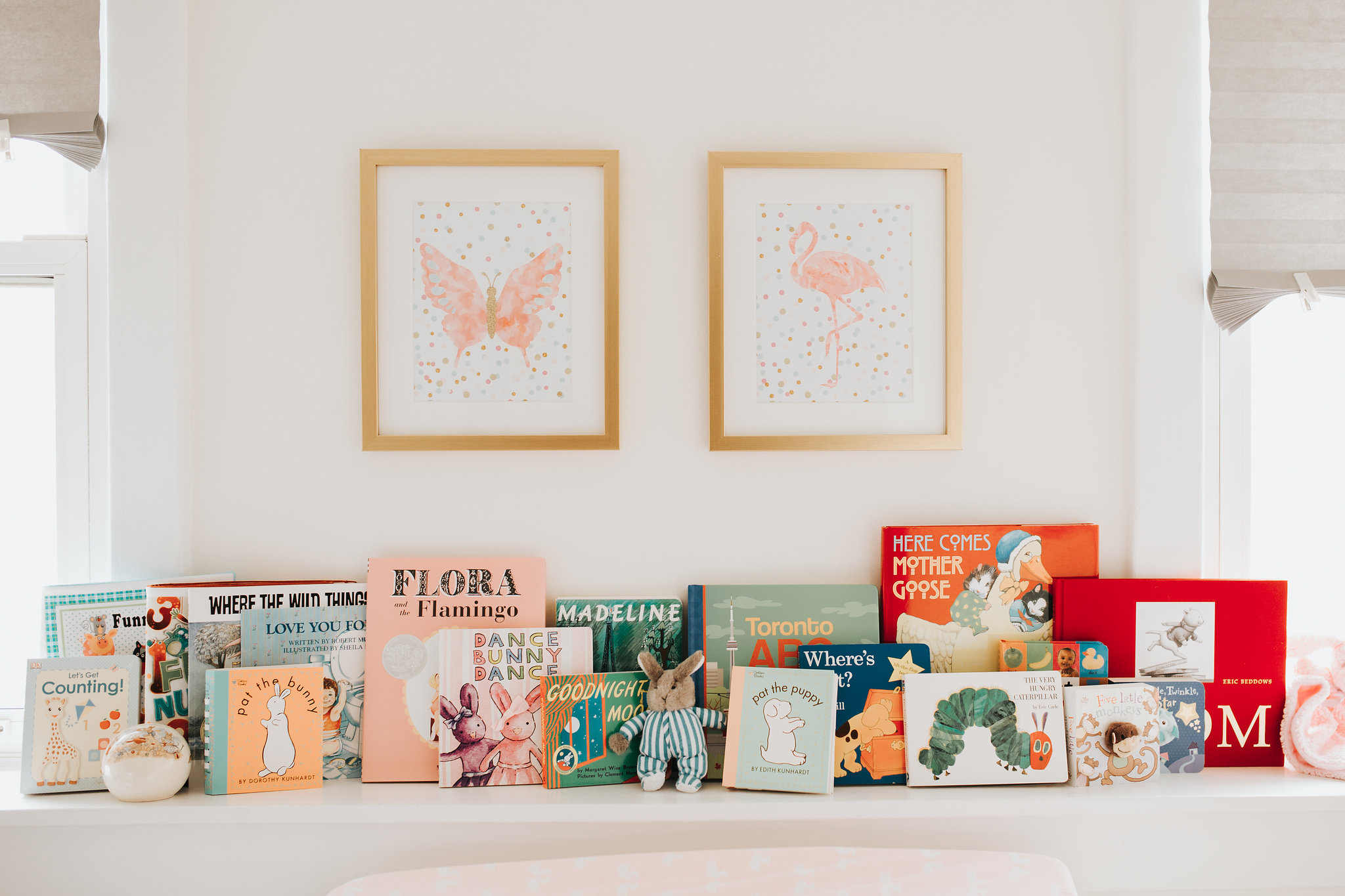 pink gold and white nursery details, baby books on shelf - Newmarket Lifestyle Photos