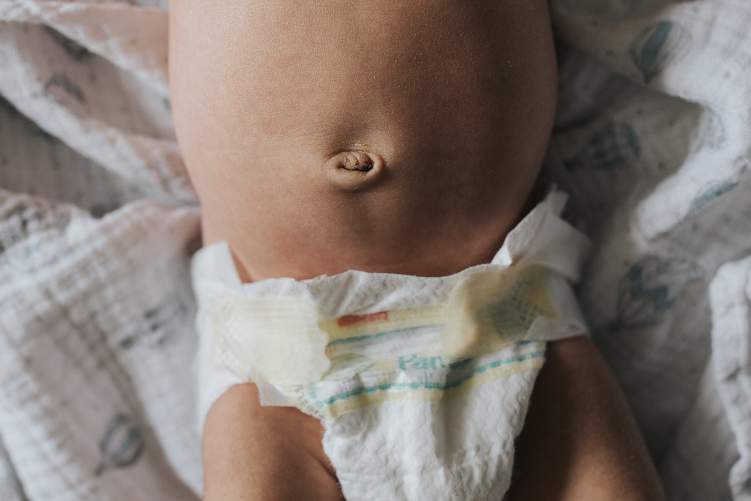 2 week old baby boy in diaper, close up of bellybutton - Newmarket In-Home Photography