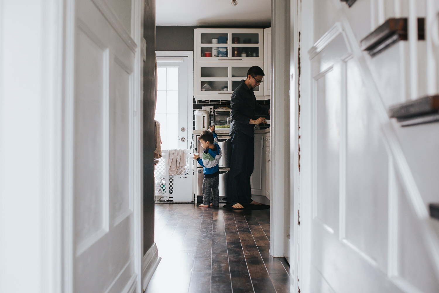dad and 2 year old toddler son in kitchen, boy getting yogurt - Newmarket Lifestyle Photography