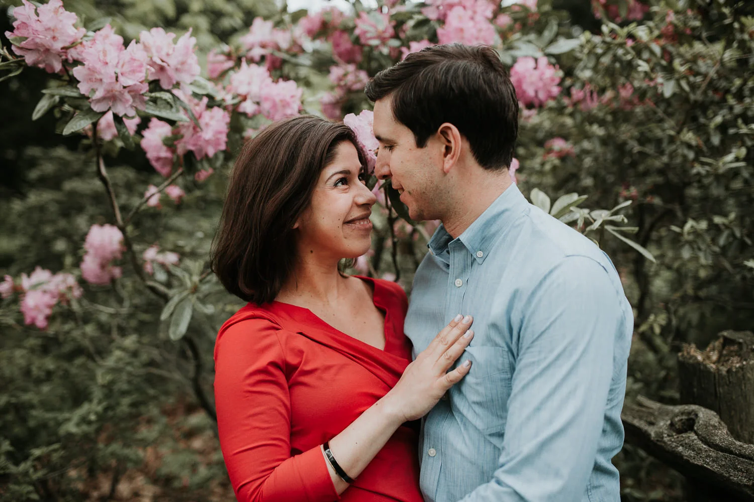 husband and wife snuggling and smile at one another - Stouffville Lifestyle Photography