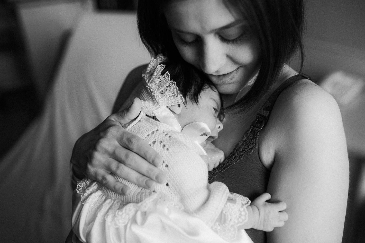 new mom cuddles 1 day old baby daughter to chest - Newmarket In-Hospital Photos