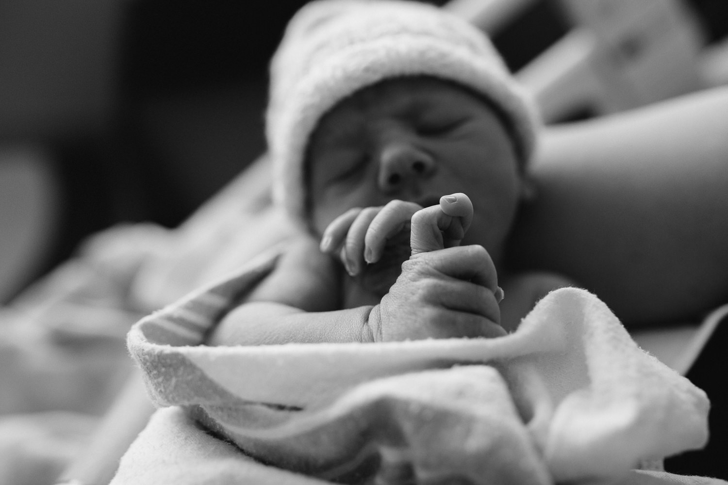 close up of sleeping, 10 hour old baby boy's hands, fingers intertwined - Newmarket Fresh 48 Photos