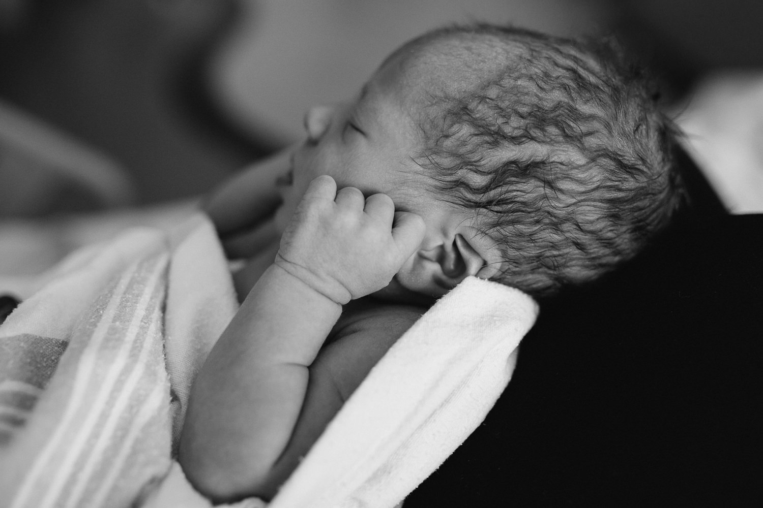 10 hour old baby boy asleep in mom's lap - Markham In-Hospital Photography