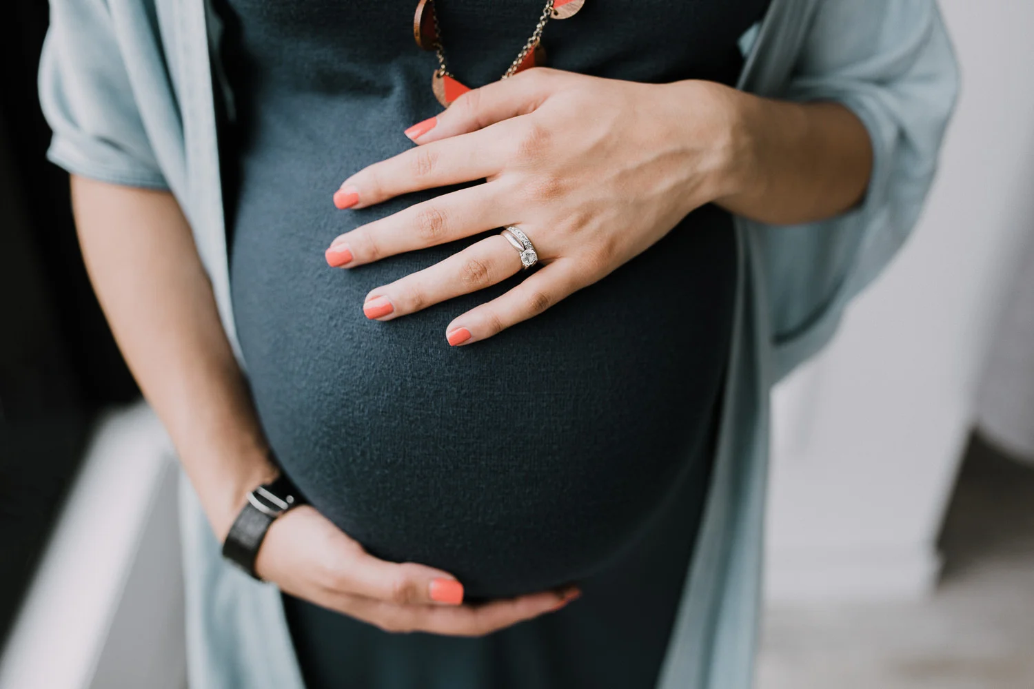 pregnant mom-to-be holding baby bump - Stouffville Lifestyle Photography