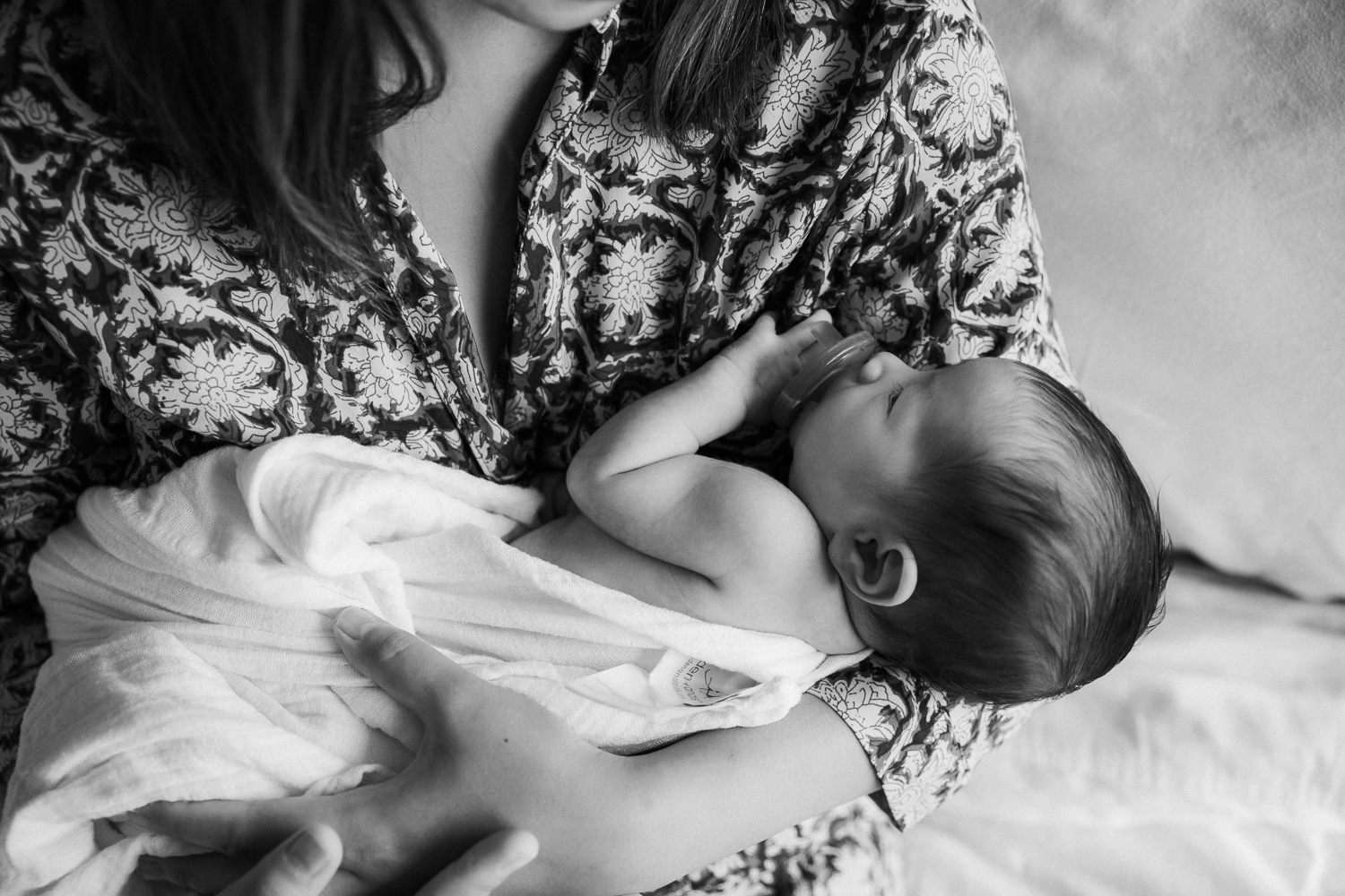2 week old baby girl sleeping in mother's arms - Stouffville Lifestyle Photography