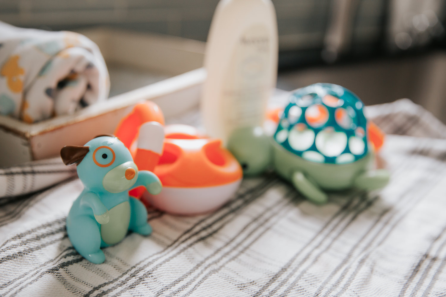 rubber bath toys sitting on towel on kitchen counter - GTA In-Home Photography