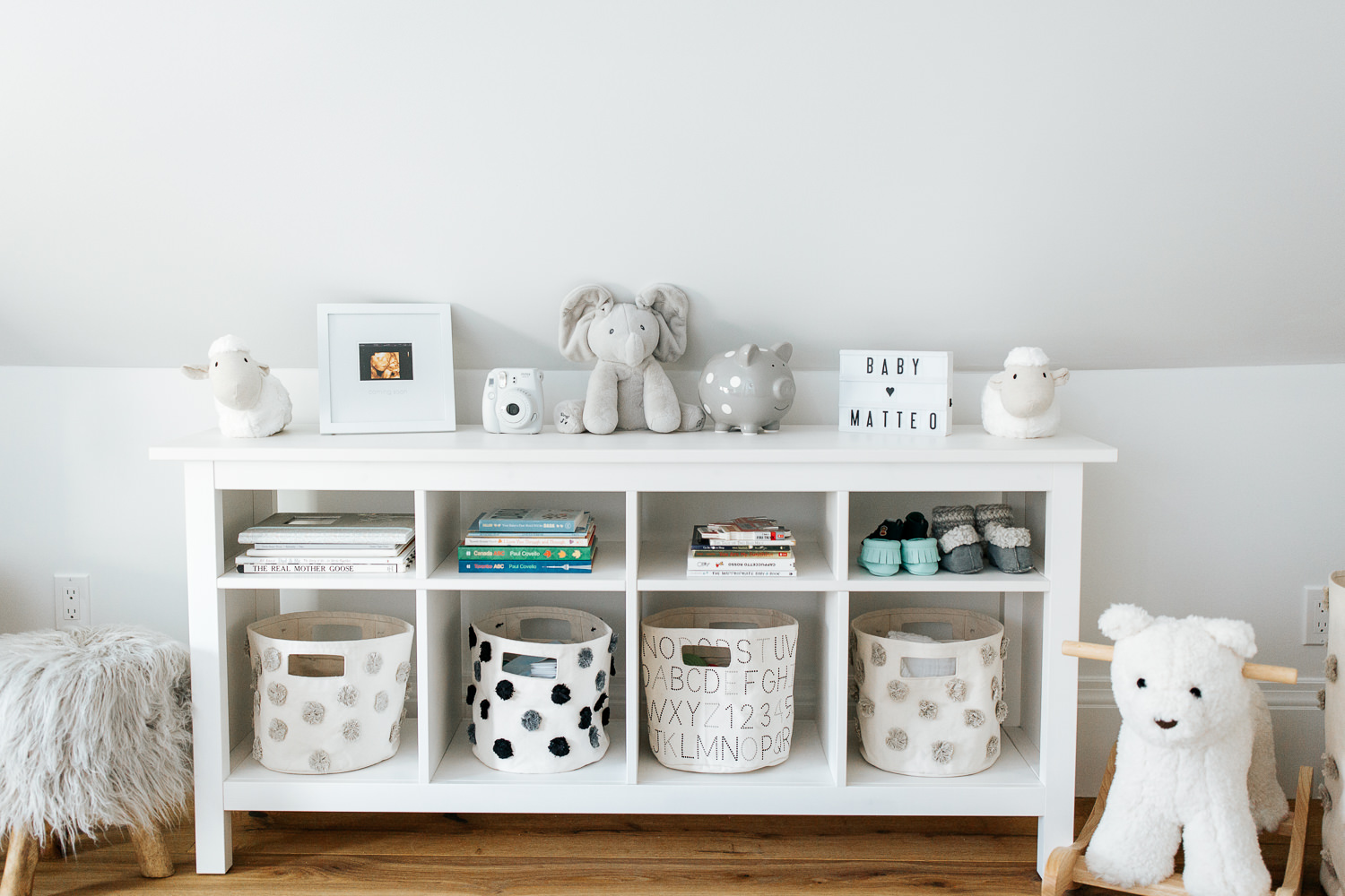 neutral grey and white nursery details, shelf with baskets, books and toys - Stouffville In-Home Photos