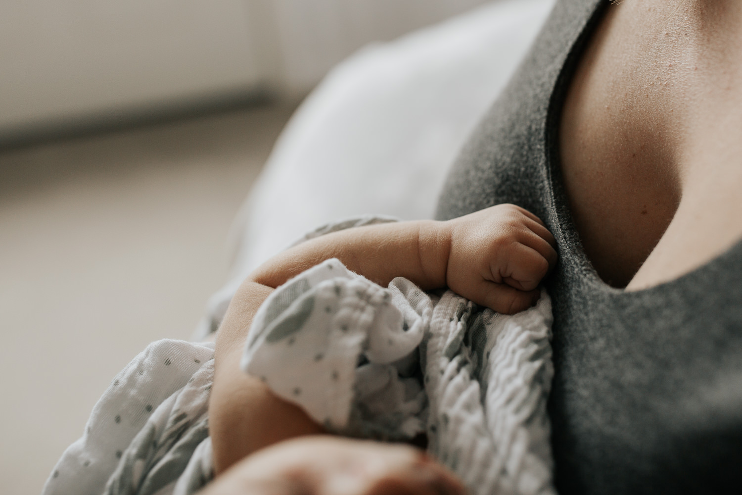 York Region Lifestyle Photos - close up of 2 week old baby boy's hand as he sleeps in his mother's arms