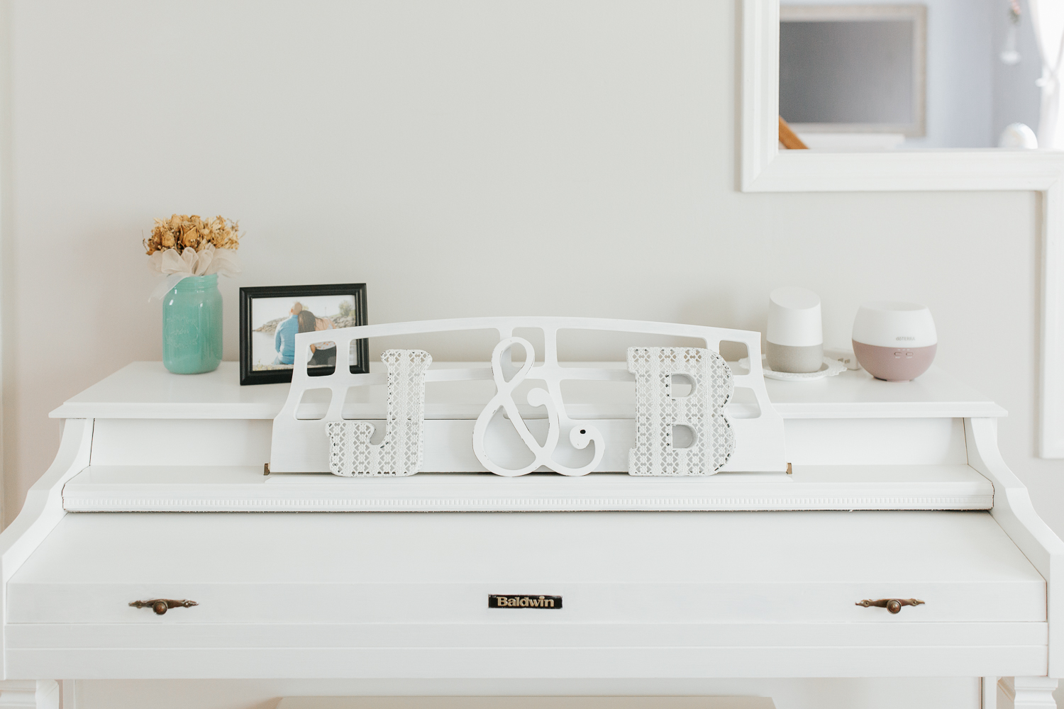 home decor on white piano - Barrie Lifestyle Photos