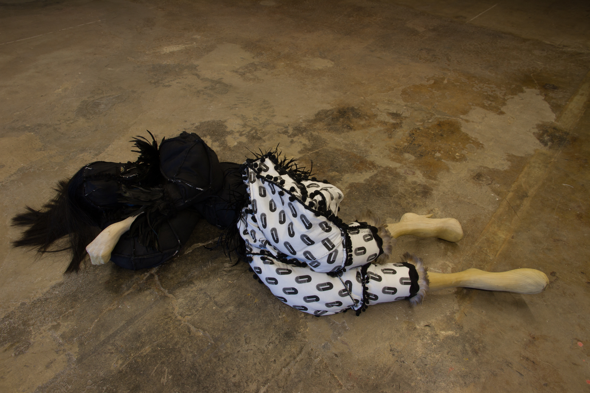 Heather and Ivan Morison strive to make art of the world. Their hard-to-define works, which take multiple forms and are often presented in unusual contexts, slip and slide between the interior realm of art and the pedestrian world of everyday life. This transitory slippage purposefully implicates us, the viewers, who (consciously or not) partake in an existential game of definition and validation. Inside the hallowed space of the gallery, the Morisons’ works seem to conform to our textbook understanding of what art is: discrete objects on display for our visual and intellectual consumption. We walk around them, inspect them, perhaps admire them, and attempt to unlock their intrinsic meaning, at least as intended by the artist. The relationship between the artist and viewer—if there is one—exists solely within the transference of experiencing the object. In this conventional scenario, we, the viewers, are outsiders looking in. But when we let go—and this is what the Morisons excel at making us do—then we begin to notice how objects relate to one another, their context, and ourselves. This connection between objects and the larger environment in which they are situated is of critical importance to the Morisons. In their installations, every detail is considered—the color of the walls, the placement of works, the specific type of lighting, the location of texts, as well as other elements, including the trajectory of physical bodies. How we, as viewers, might move through the space and interact with the works has also been contemplated by the artists who, by necessity, are open to multiple experiential possibilities. To those ends, the artists have had to relinquish absolute control and accept that we are part of the work and critical to its existence and meaning. But what happens when someone other than us—a performer, perhaps—activates these pieces within the space? Do these individual works of art transform into simple props for telling a story? Are they still worthy of our study and desire? Does this change our initial impression of what they are, what they mean, and what their intrinsic value is? Now that they are part of a larger universe (but weren’t they always?) they seem to operate differently. We certainly understand them differently than we did when they were static. And, to further problematize this situation, what happens when the performer and prop leave the gallery and enter the city, into the real world? Does the object transform yet again? Is it still art? Or, by virtue of the audience that encounters it outside of the privileged sanctuary of the gallery, does it just become part of life? Then it is truly art of the world. Elizabeth Dunbar, Executive Director, DiverseWorks, Houston