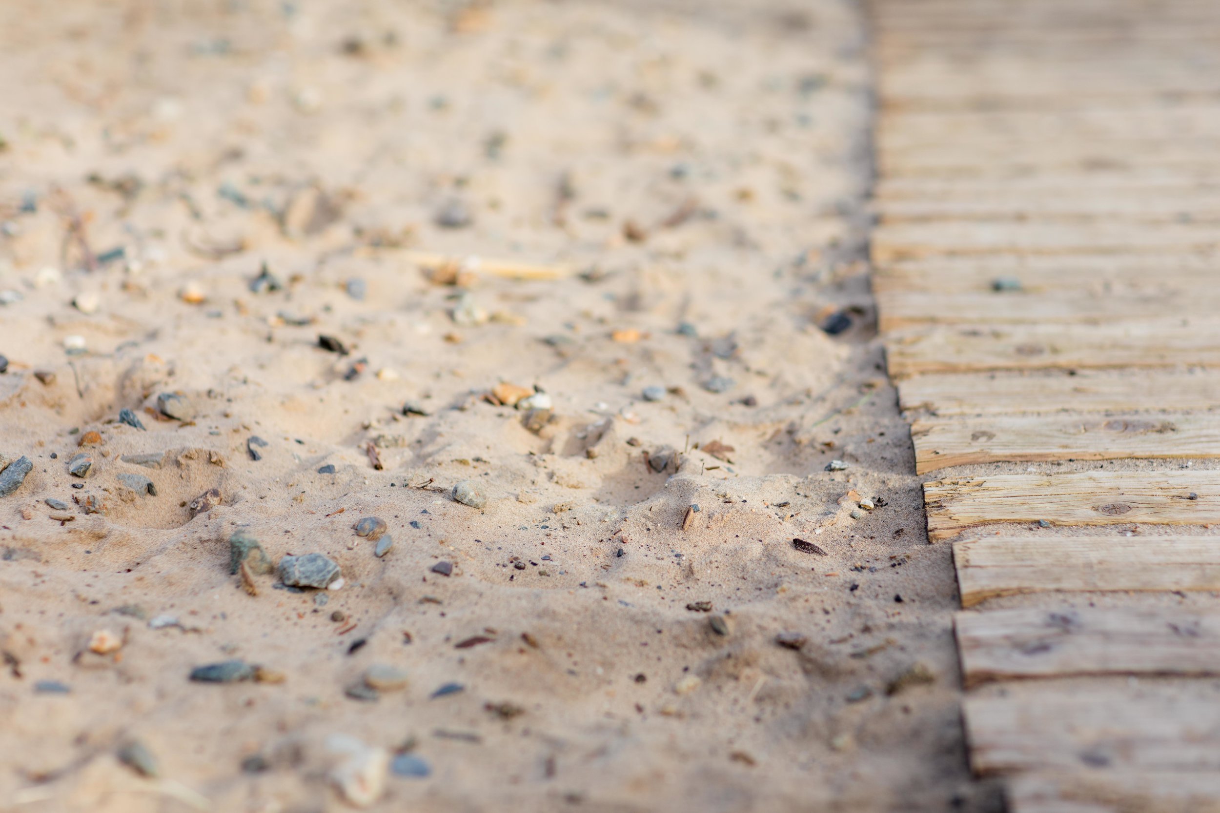sandy beach at brittas bay in ireland a close up of the sand and stones