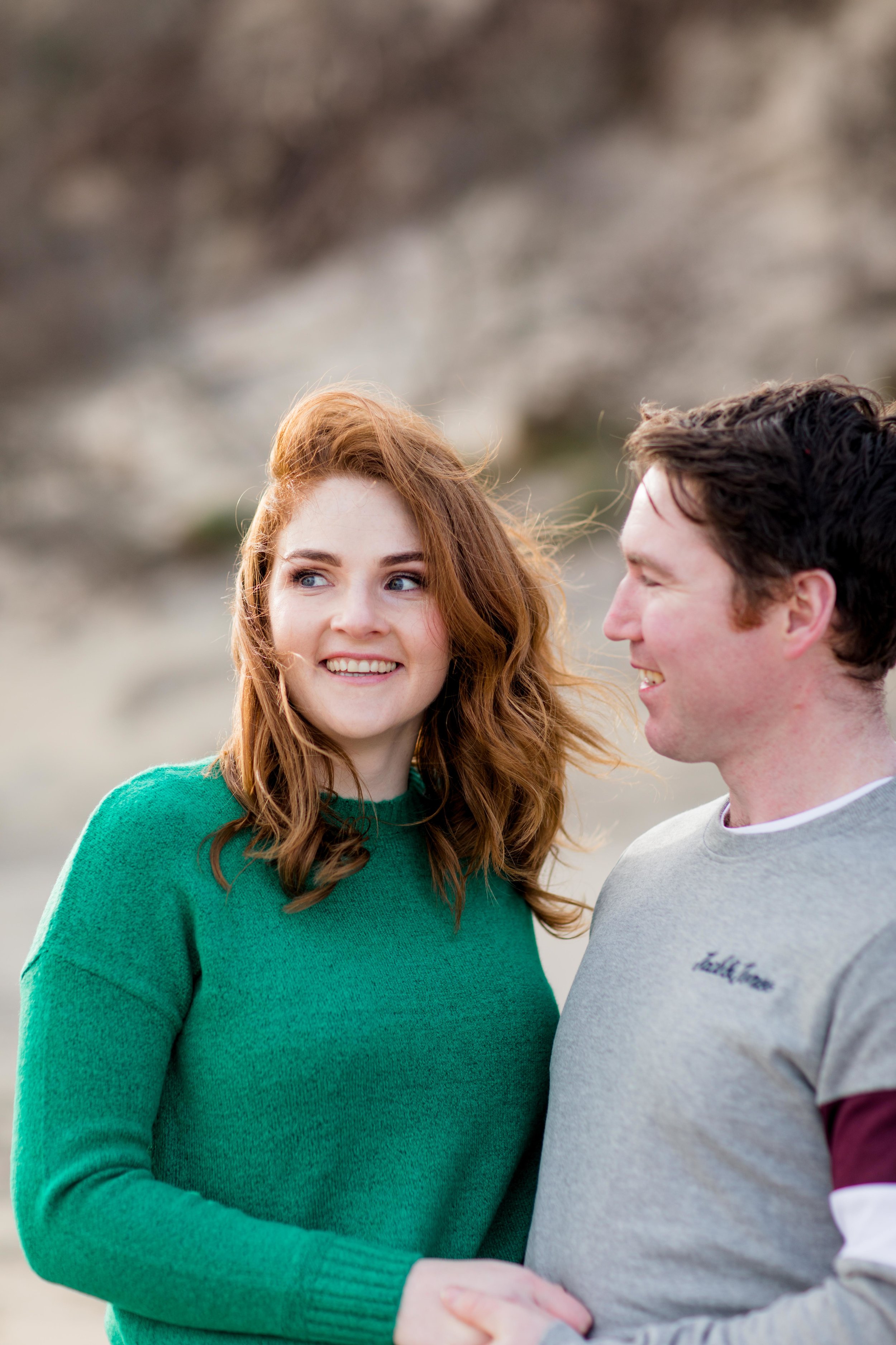 Red hair and green jumper engagement photoshoot at brittas bay ireland