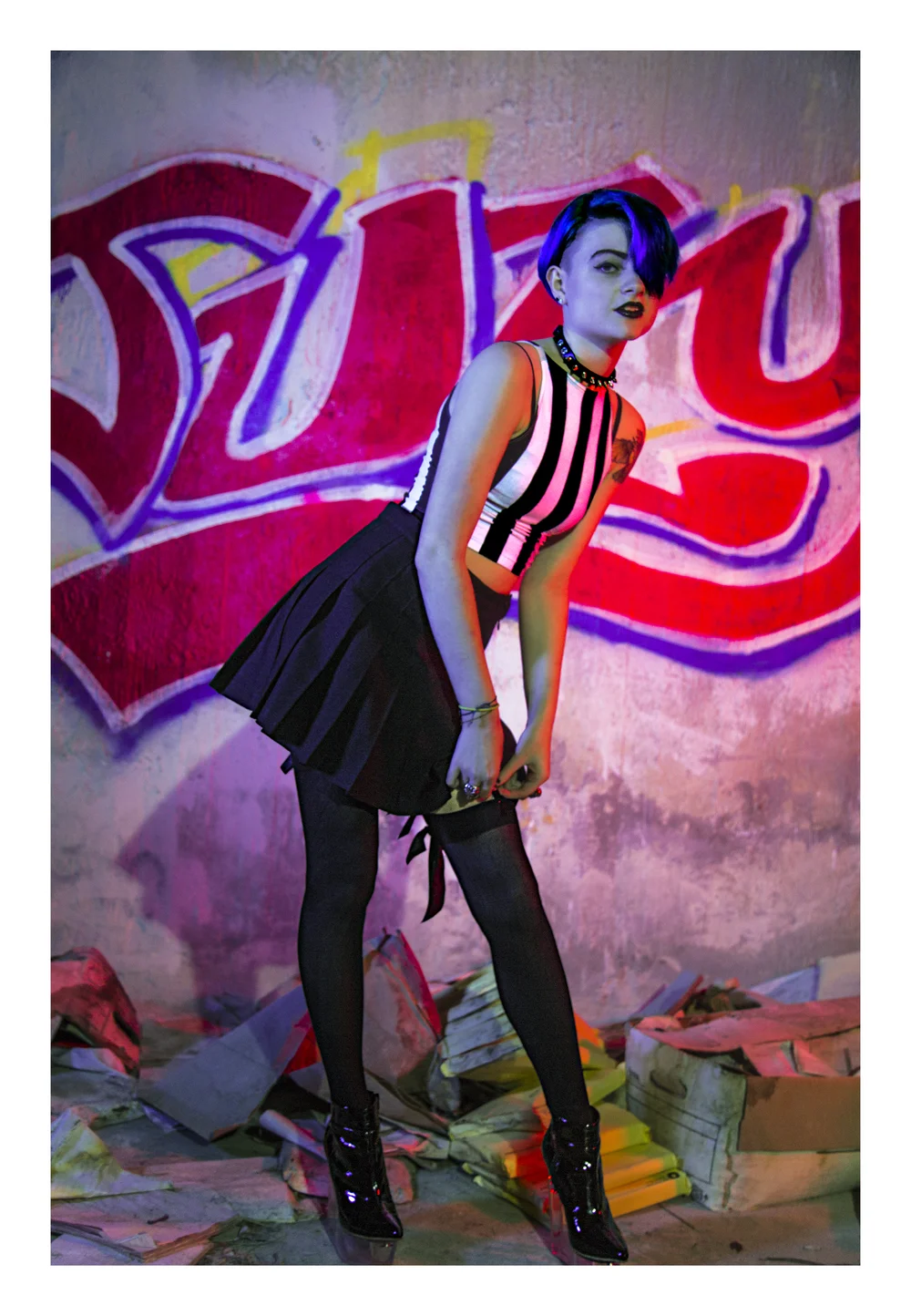 Alternative fashion portrait against graffiti