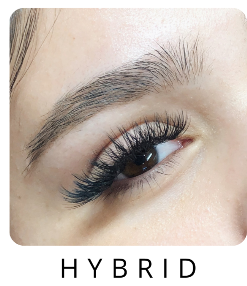 Picture of a woman's eye with hybrid lash extensions on