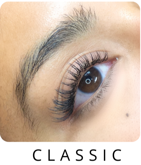 Picture of a woman's eye with classic lash extensions on