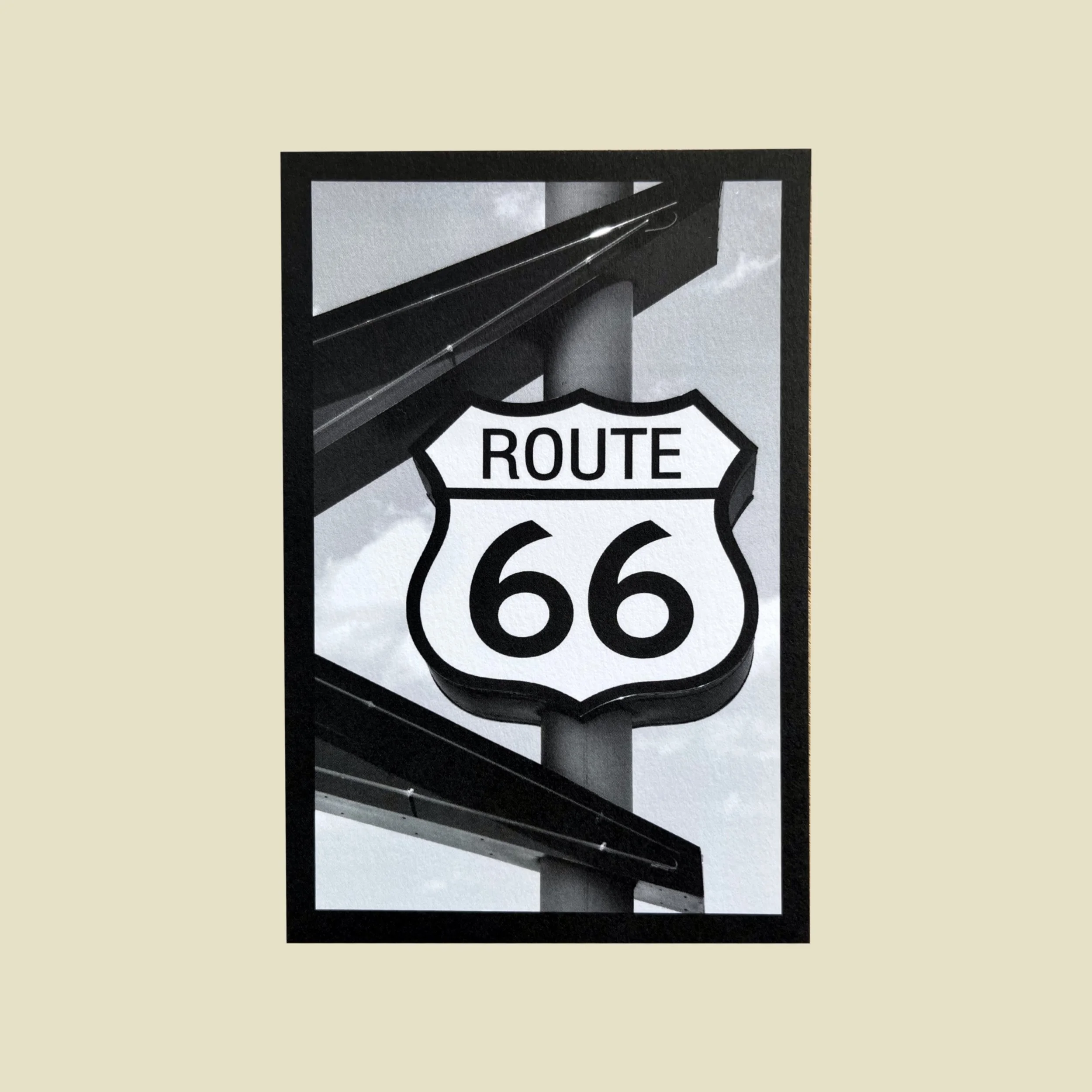 the front of a postcard that has a photo of a route 66 sign