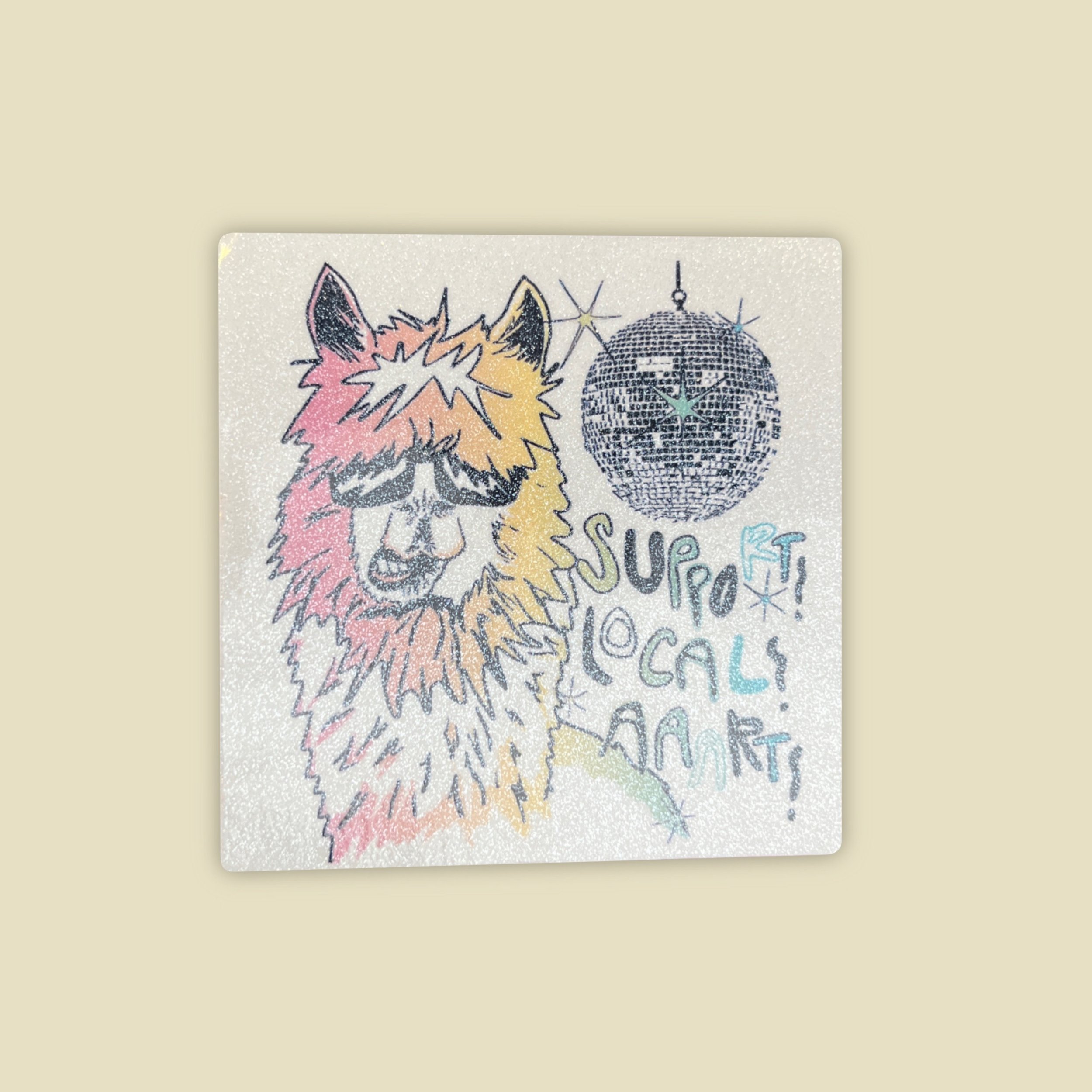 a white glitter sticker of a llama, disco ball and the words "support local art"
