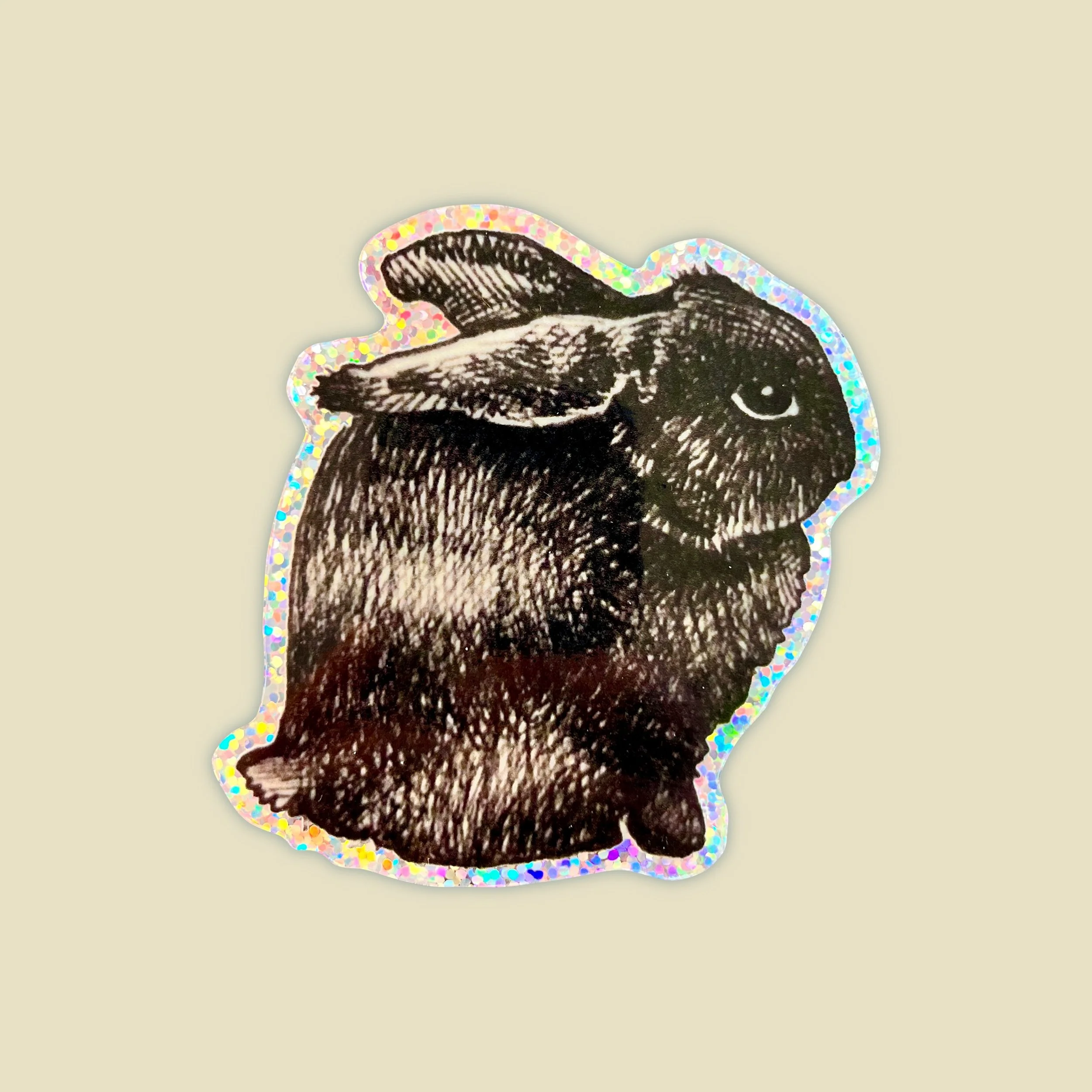 a holograohic sticker of a black bunny