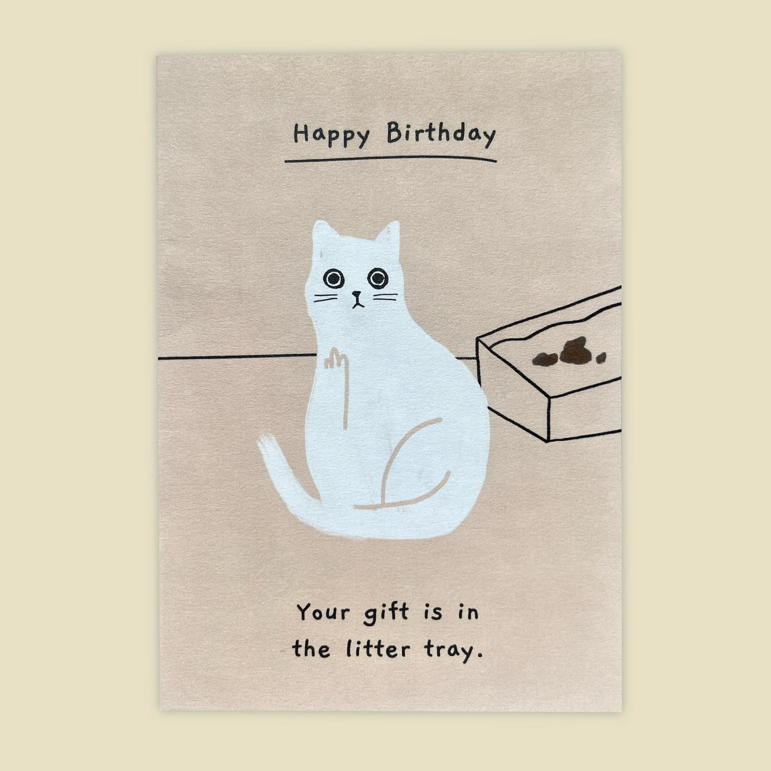 a birthday card of a cat that says "your present is in the litter tray"