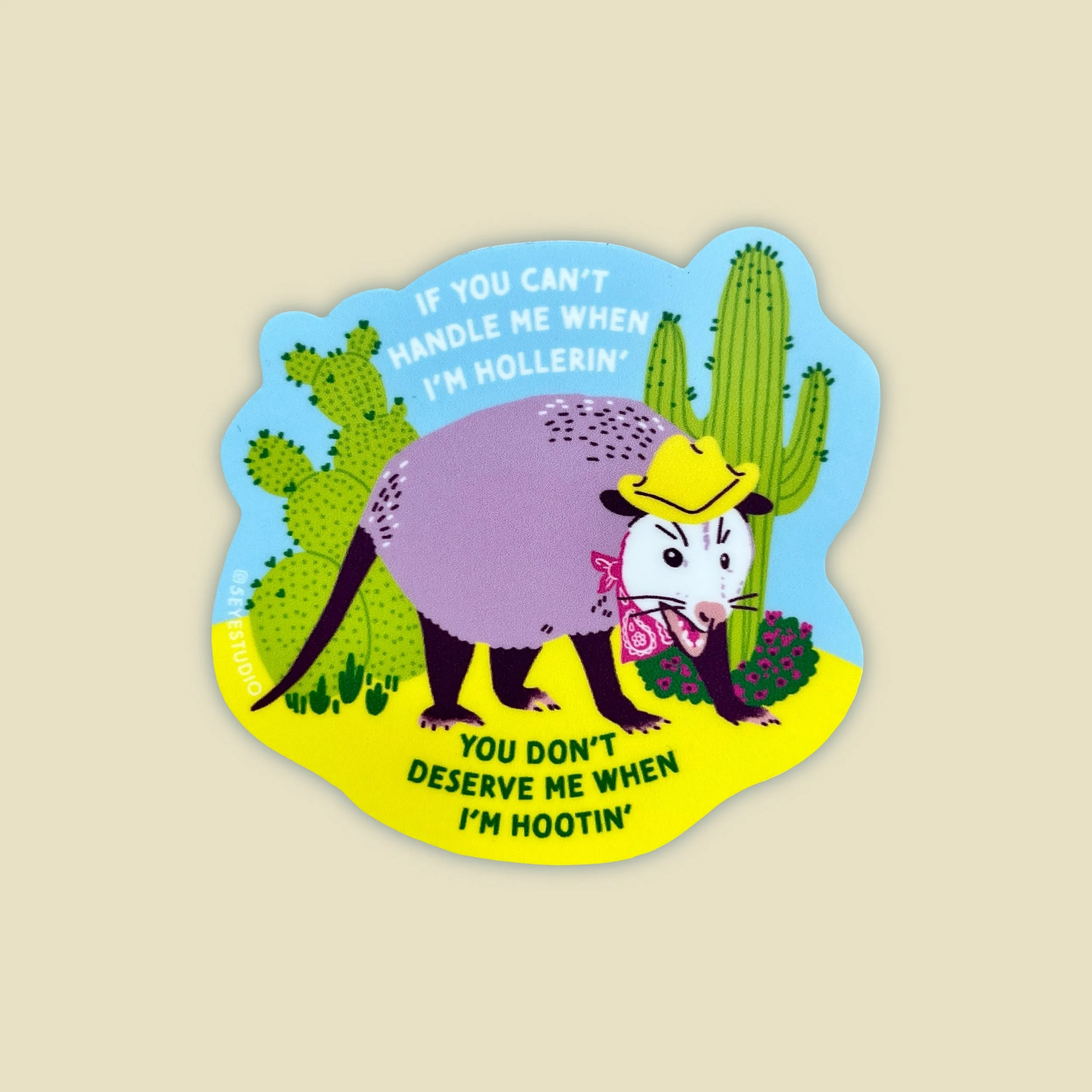 a sticker of a cowboy possum that says "if you cant handle me when im hollerin, you dont deserve me when im hootin"