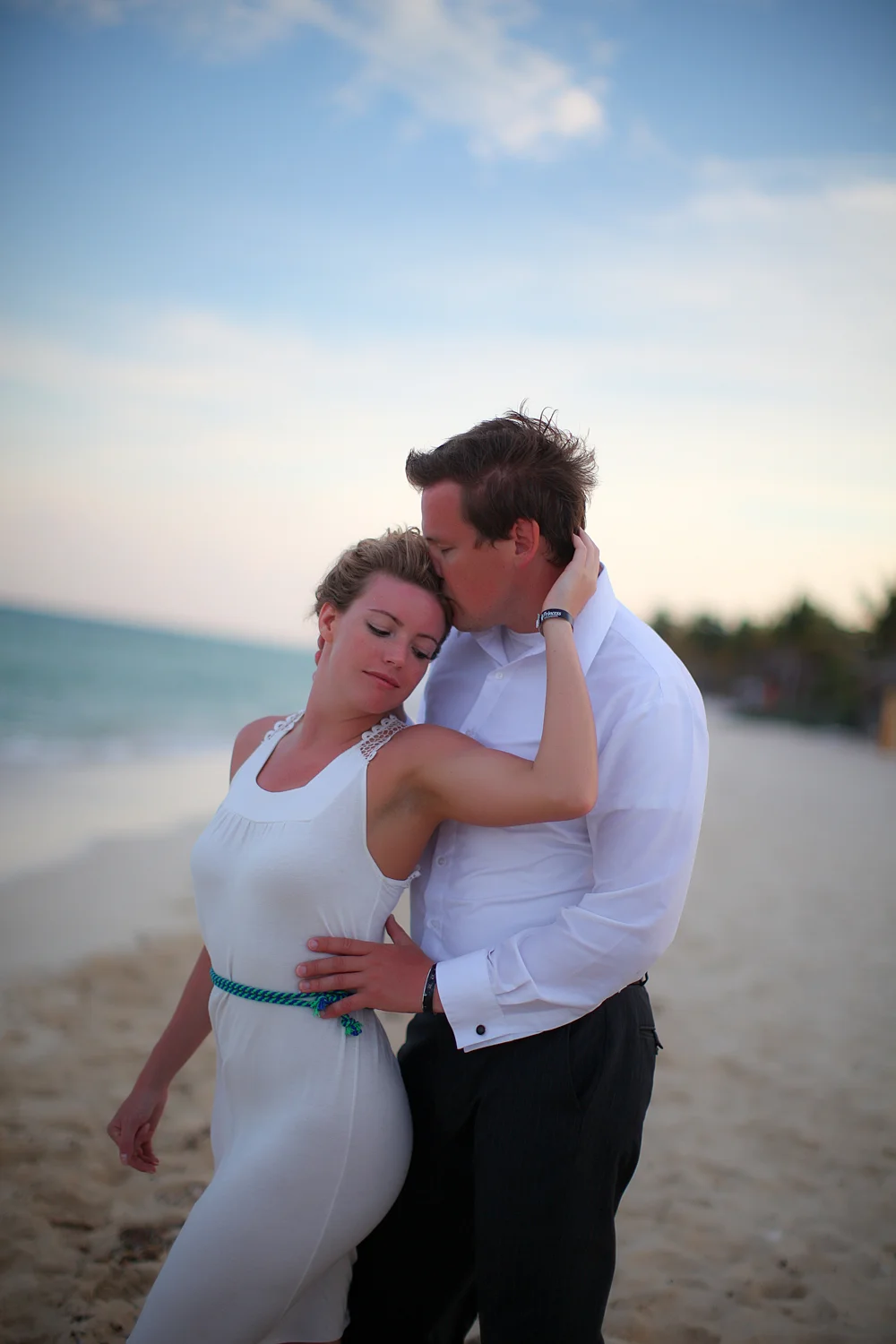 Couple kissing on Mexico beach during elopement