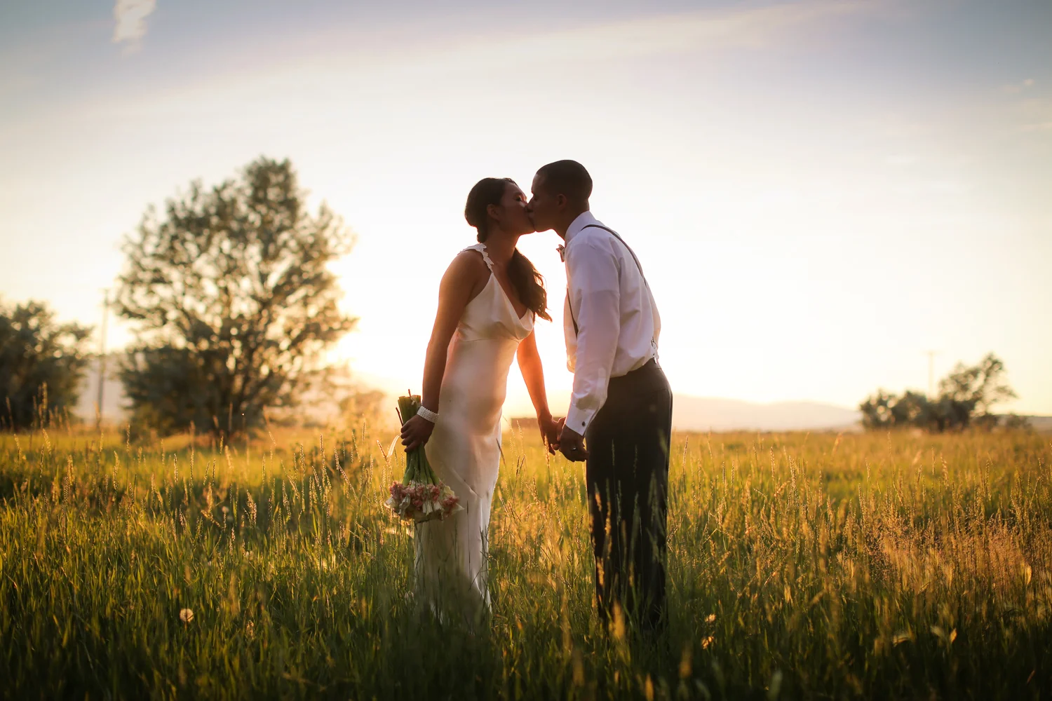 Bride and Groom kissing at sunset in Helena Montana