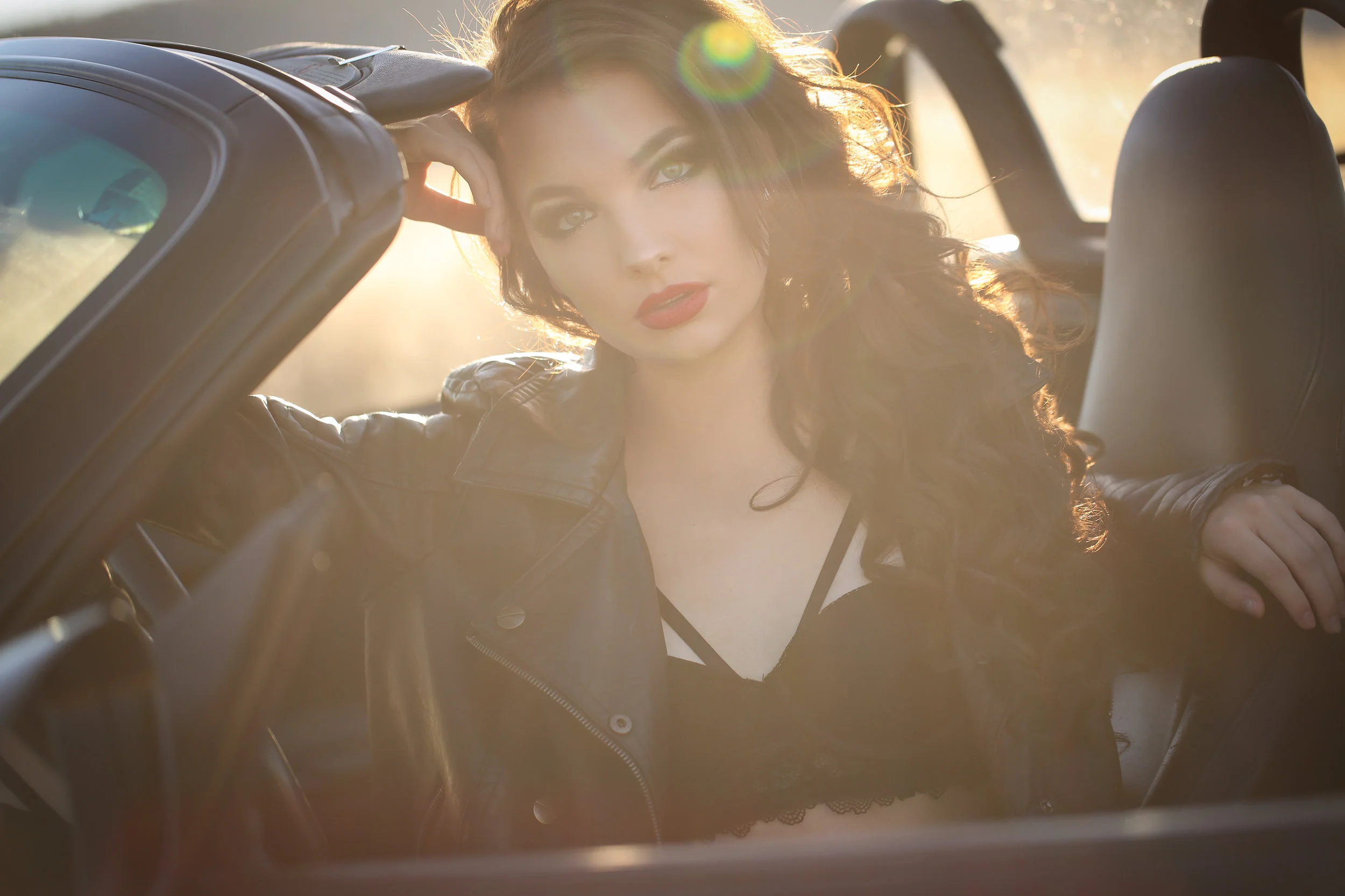 Boudoir portrait of woman in porsche