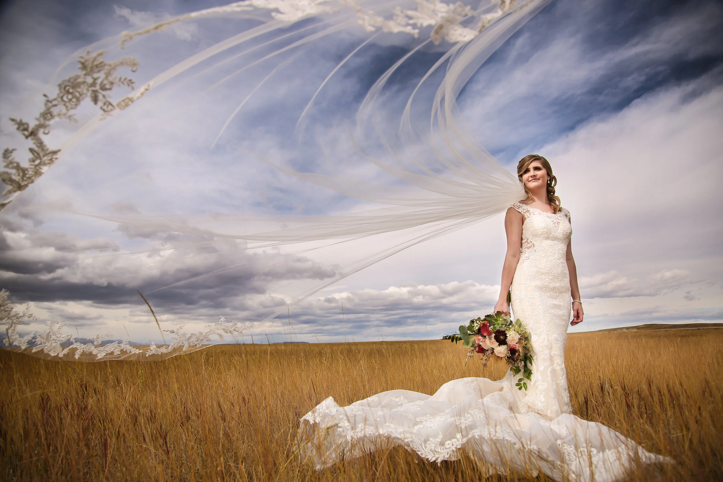 Montana Bride's cathedral wedding veil blowing in the wind