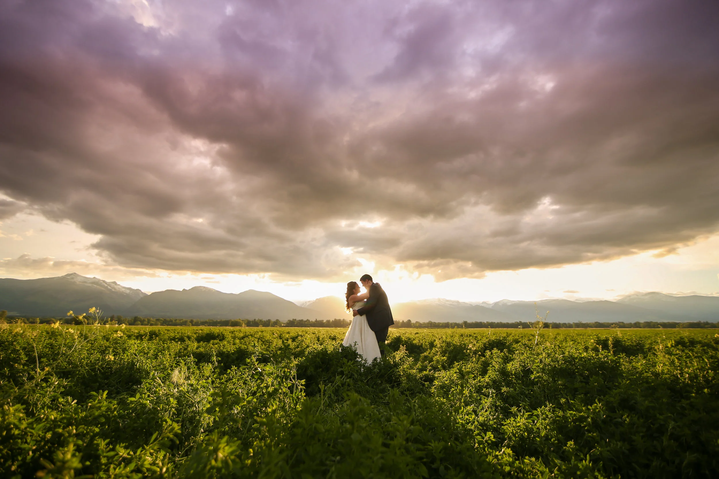 Wedding photography of bride and groom at sunset