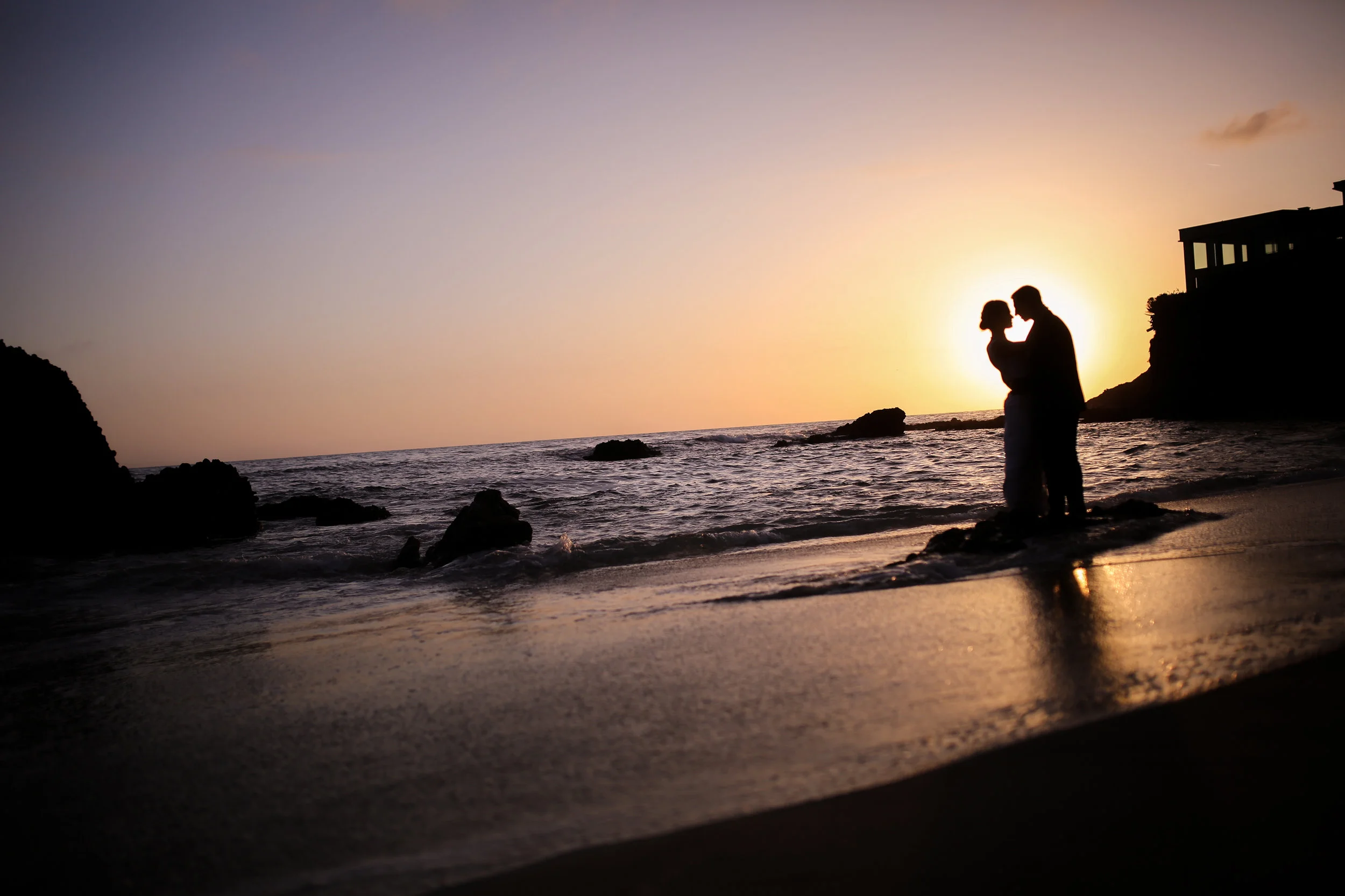 California Bride and groom at the ocean at sunset