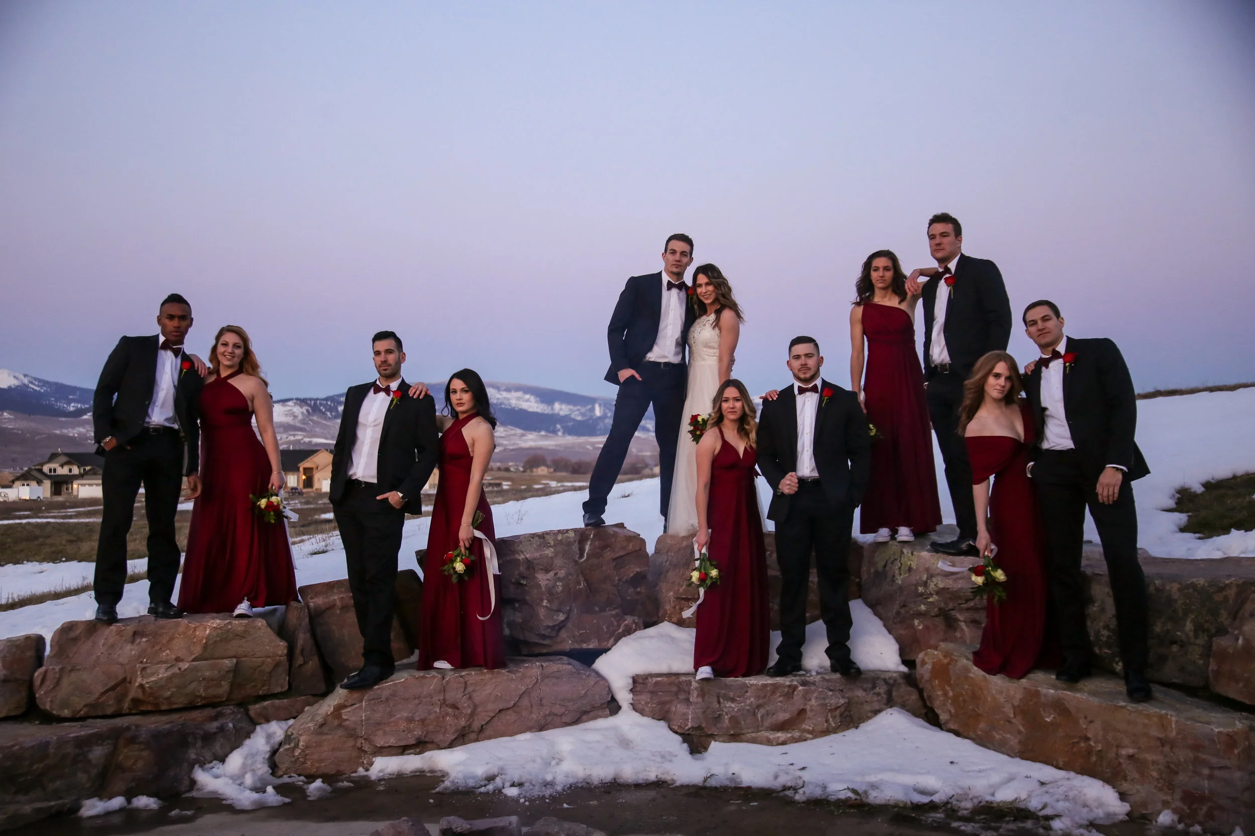 Wedding party at sunset on some boulders