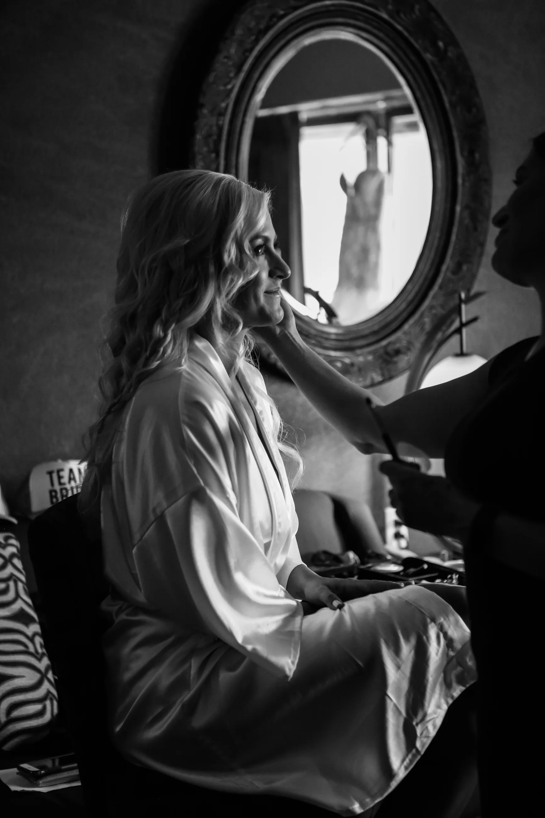 Bride with wedding dress reflection in the mirror