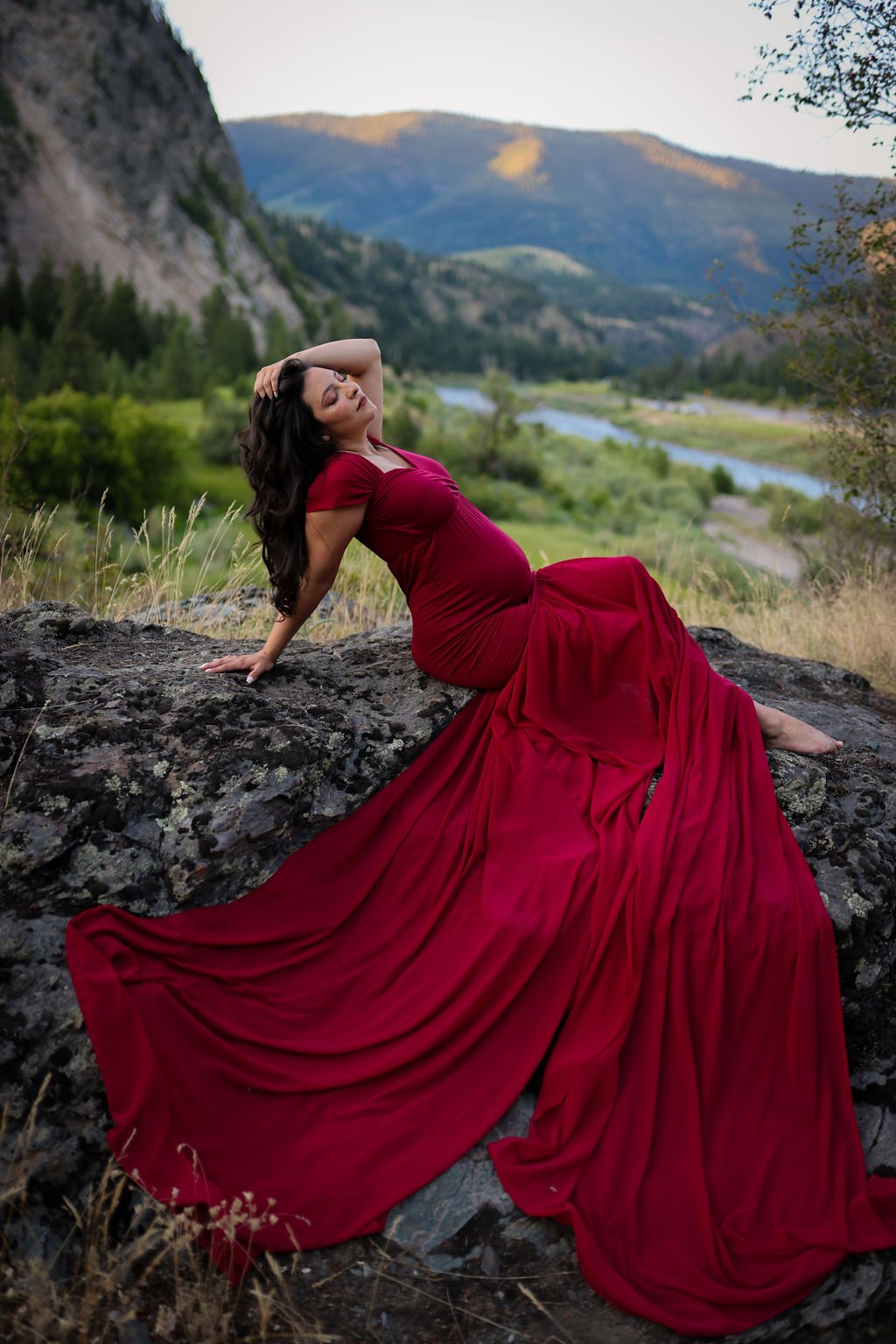 Stunning red maternity gown in Montana landscape.jpg