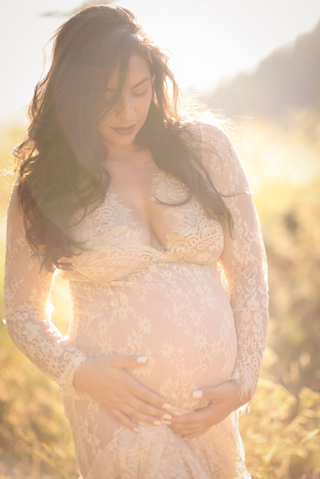 White lace maternity gown in gorgeous light.jpg