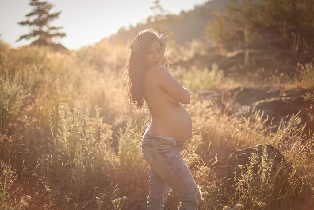 Topless maternity portrait in jeans.jpg