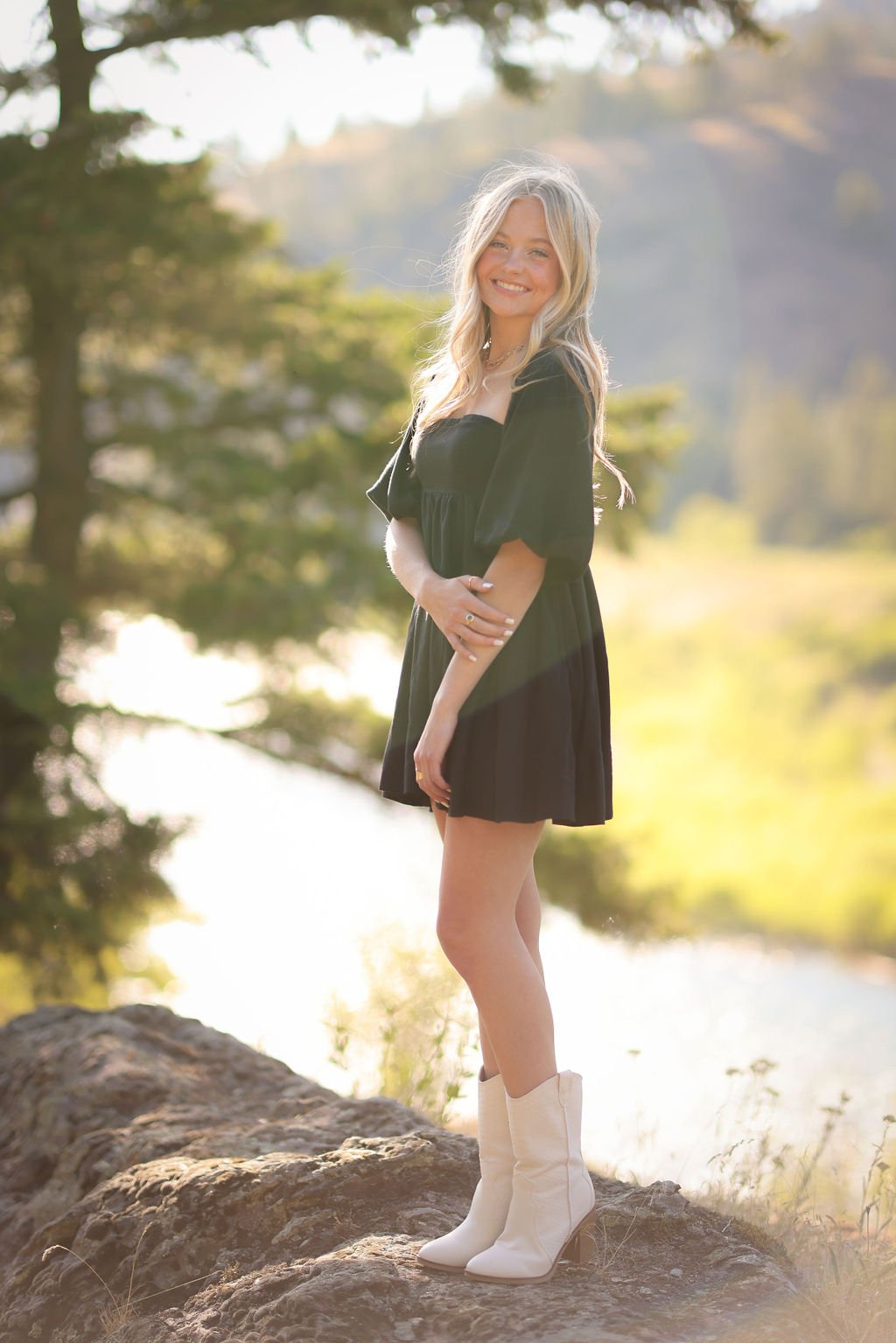 Senior portrait girl standing on rock formation.jpg