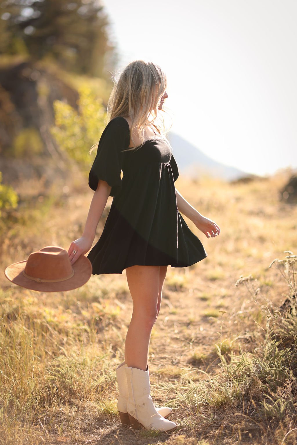 Senior portrait of girl twirling at golden hour in Montana.jpg