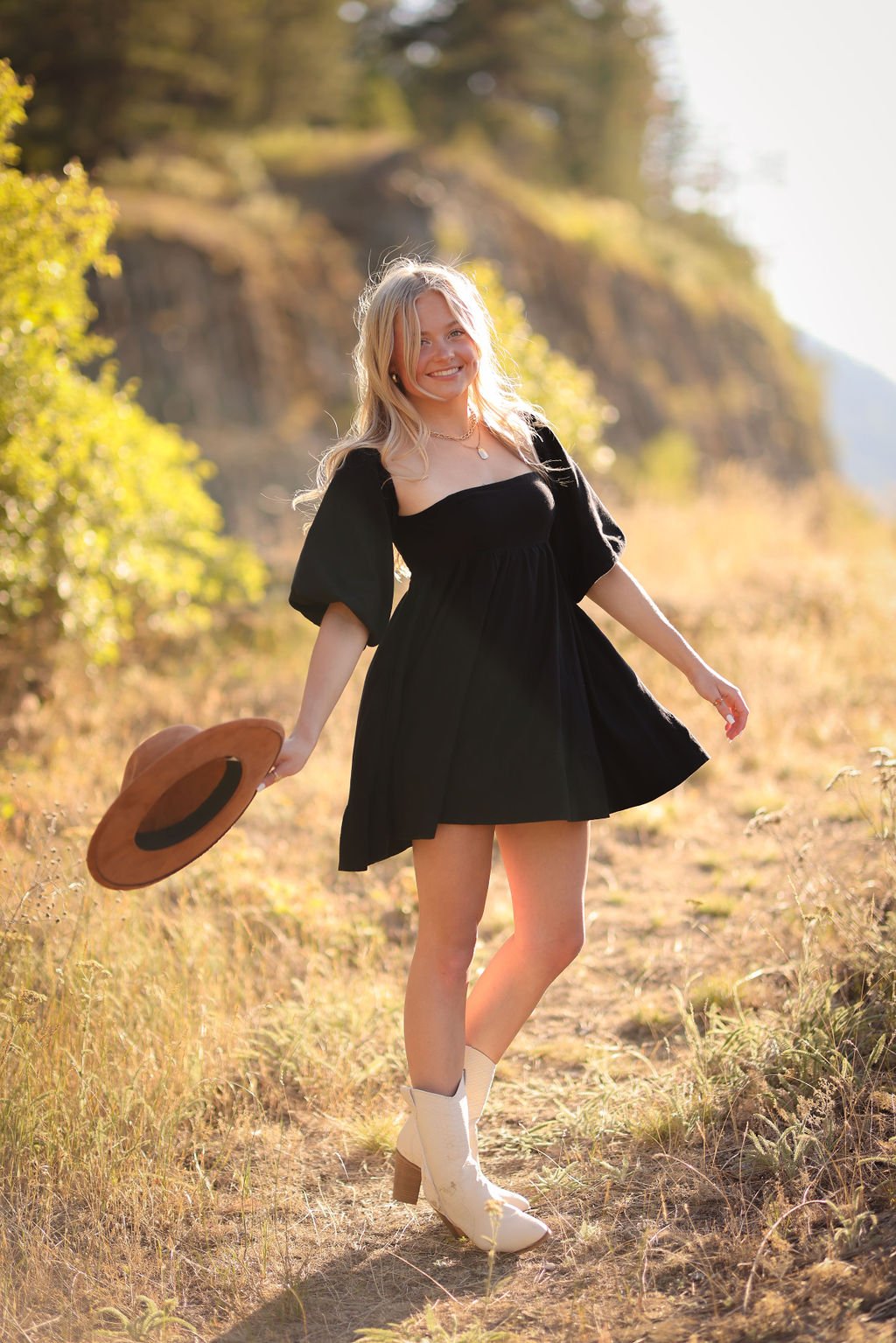 Missoula senior portrait of girl twirling in mountains.jpg