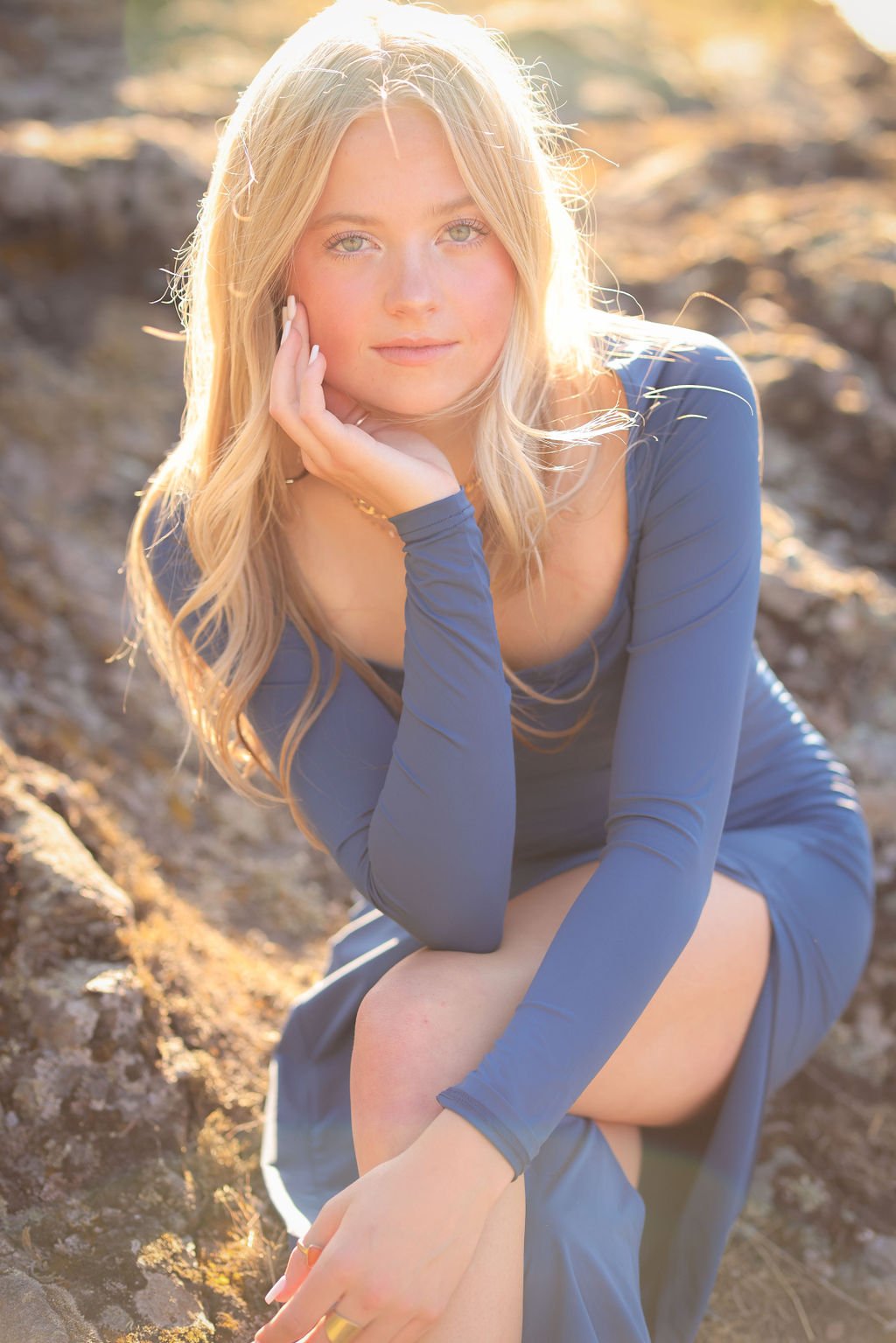 Stunning senior portrait of girl with blue eyes and matching blue dress.jpg