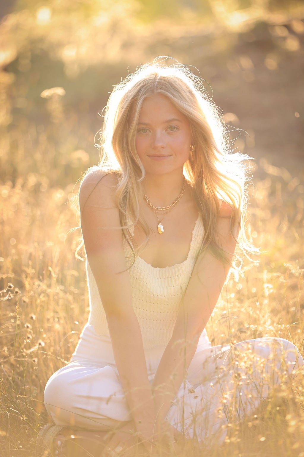 Golden hour senior portrait in Montana fall field.jpg