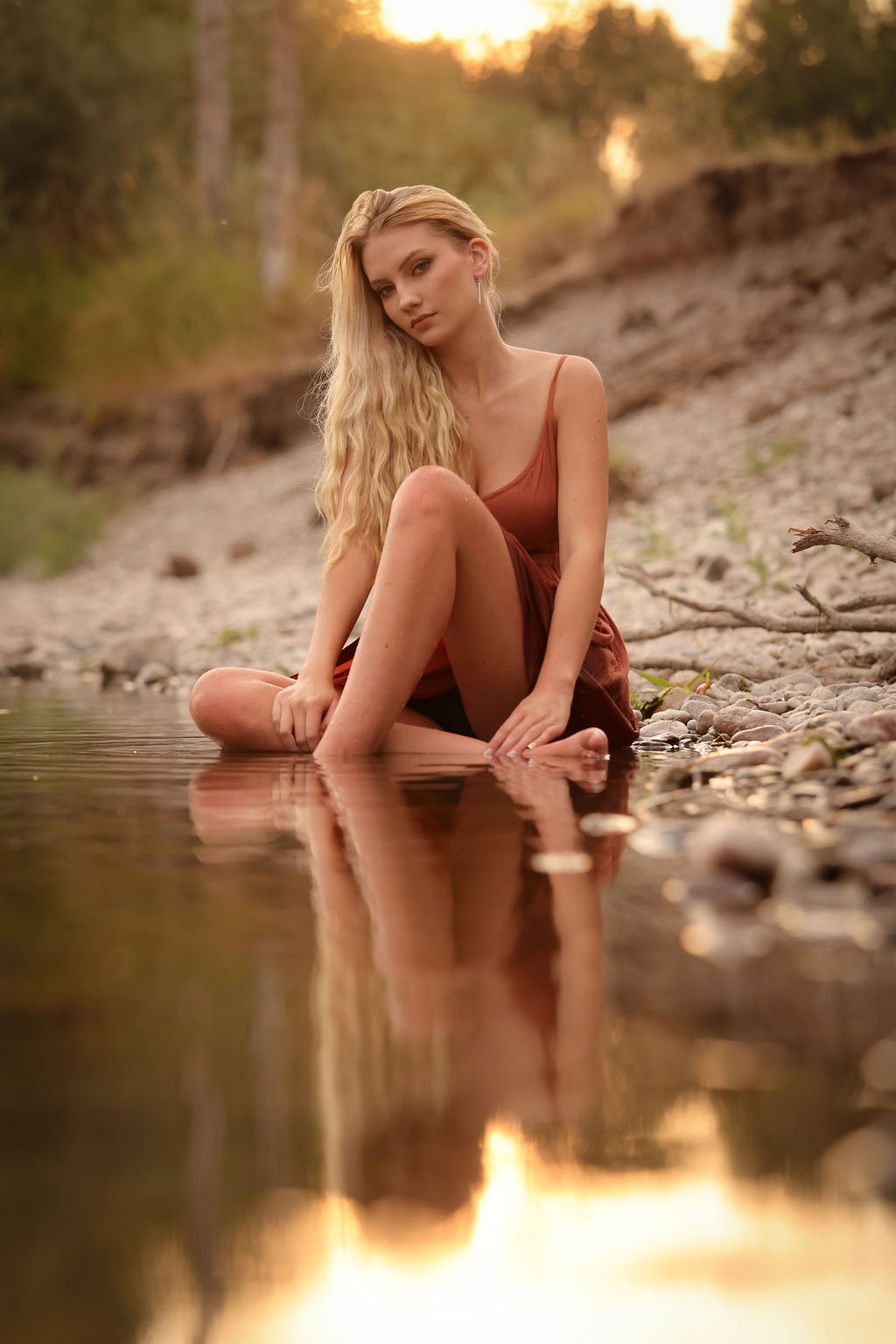Missoula high school senior by river with reflection in water.jpg