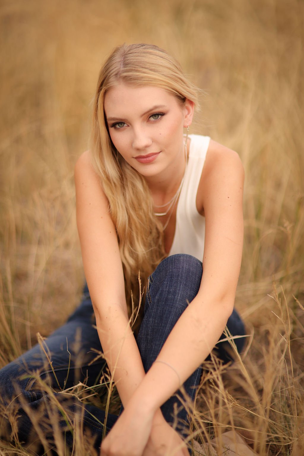 Montana high school senior portrait of girl in golden grass field.jpg