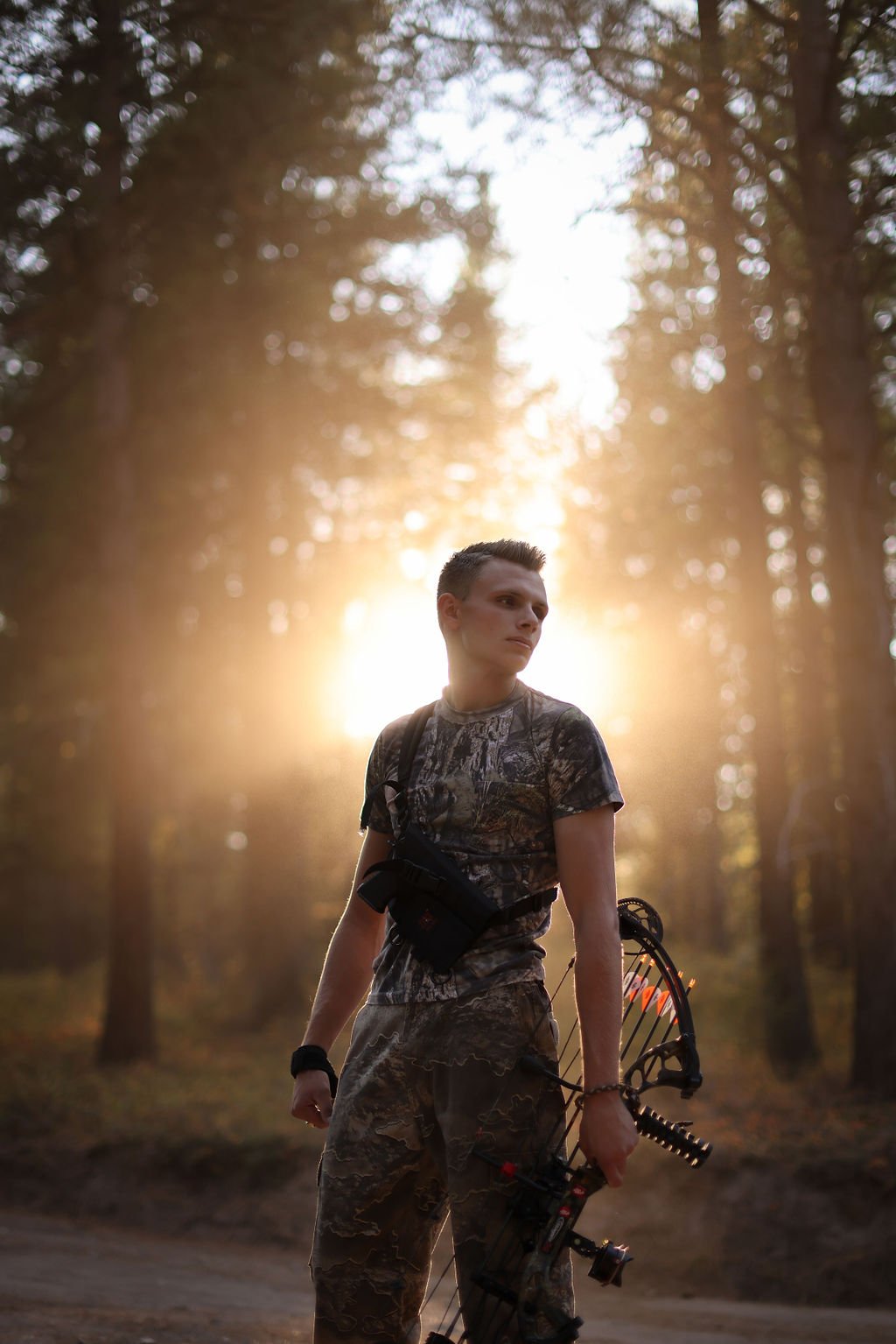 Senior portrait in bow hunting gear.jpg