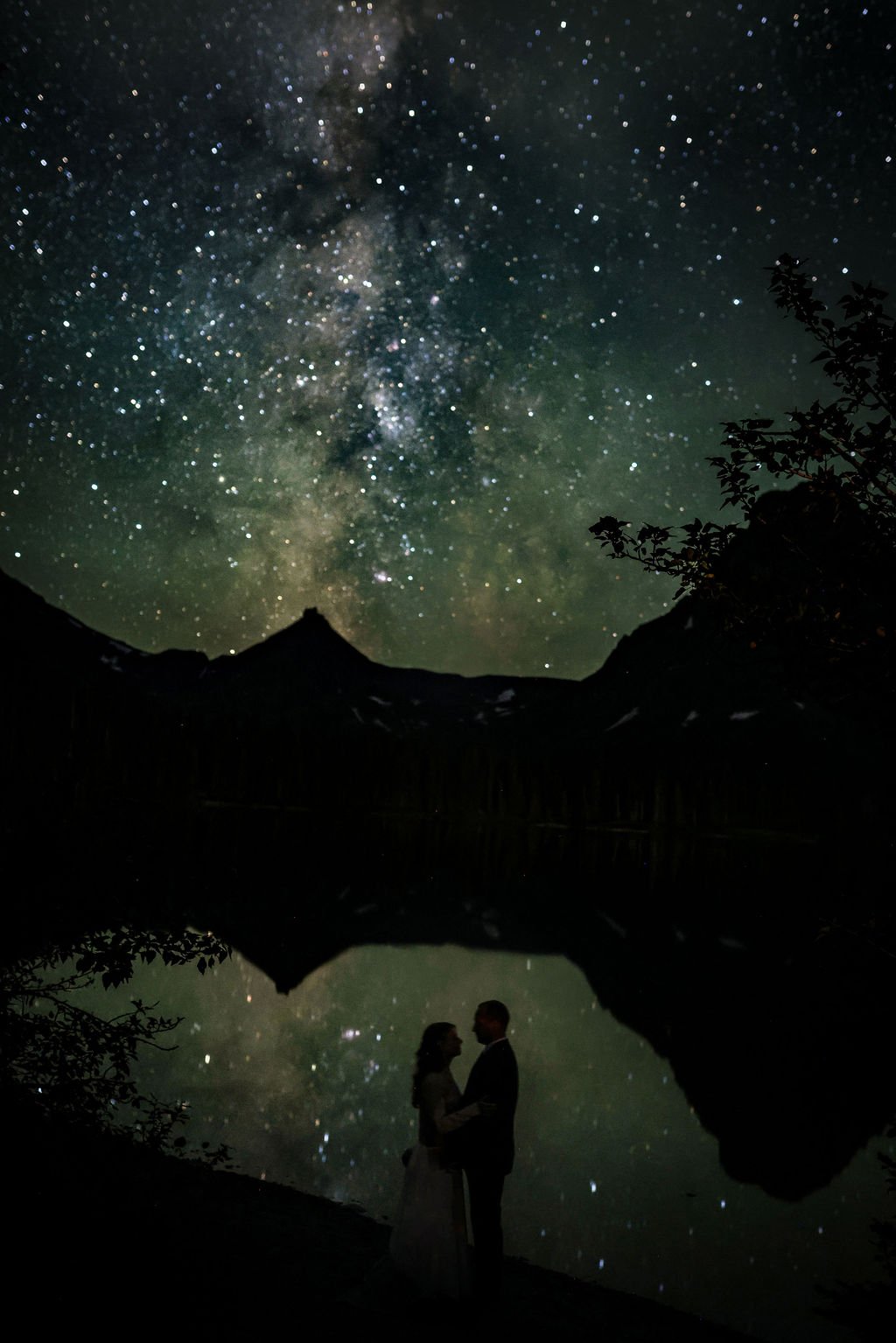 Glacier park bride and groom with milky way galaxy reflecting in st mary's lake.jpg